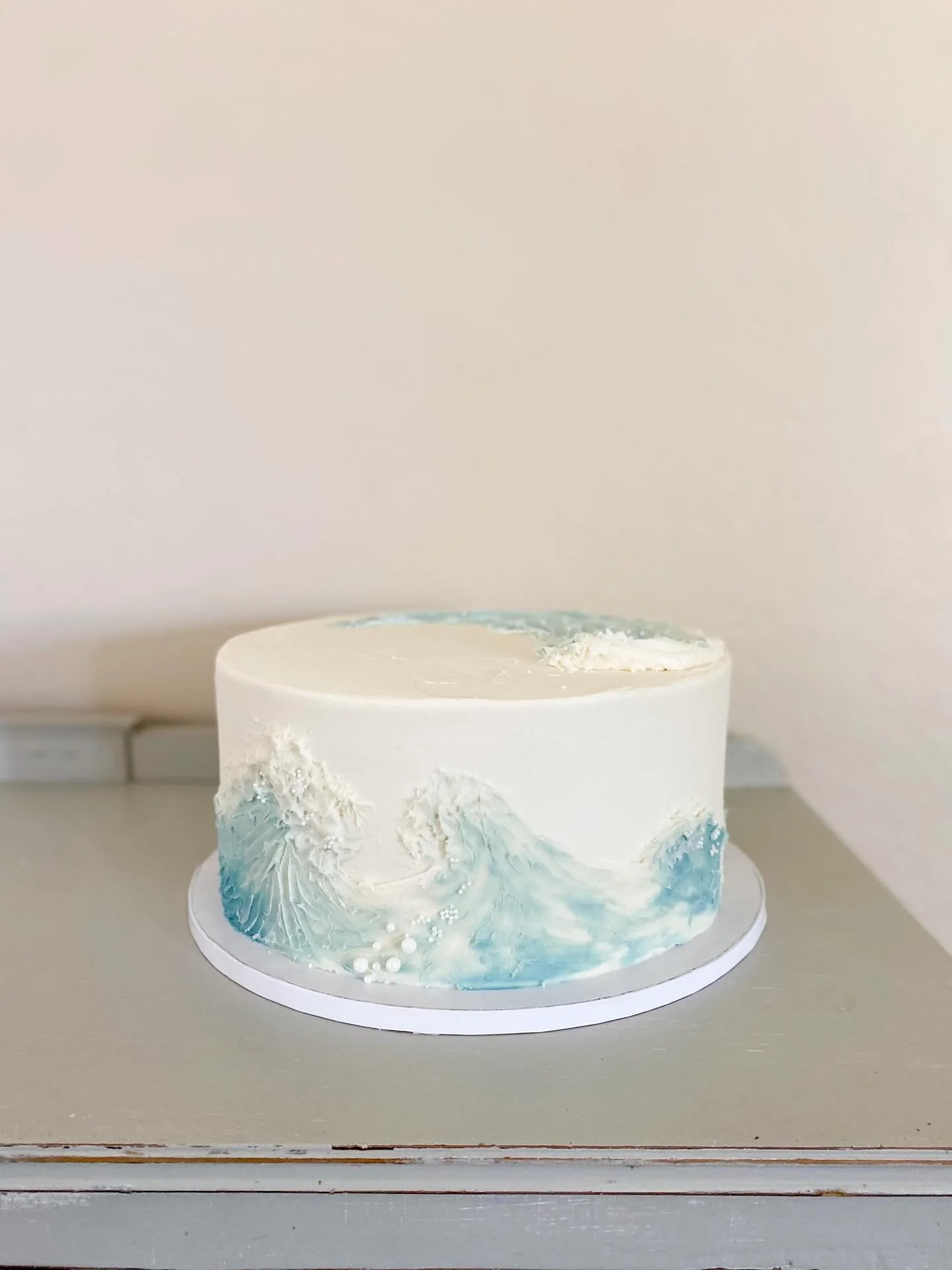 Ocean Wave cake 🌊

12&rdquo; Classic | Vanilla bean Cake layers, filled with a strawberry compote &amp; brown butter buttercream &mdash; Finished in vanilla buttercream.