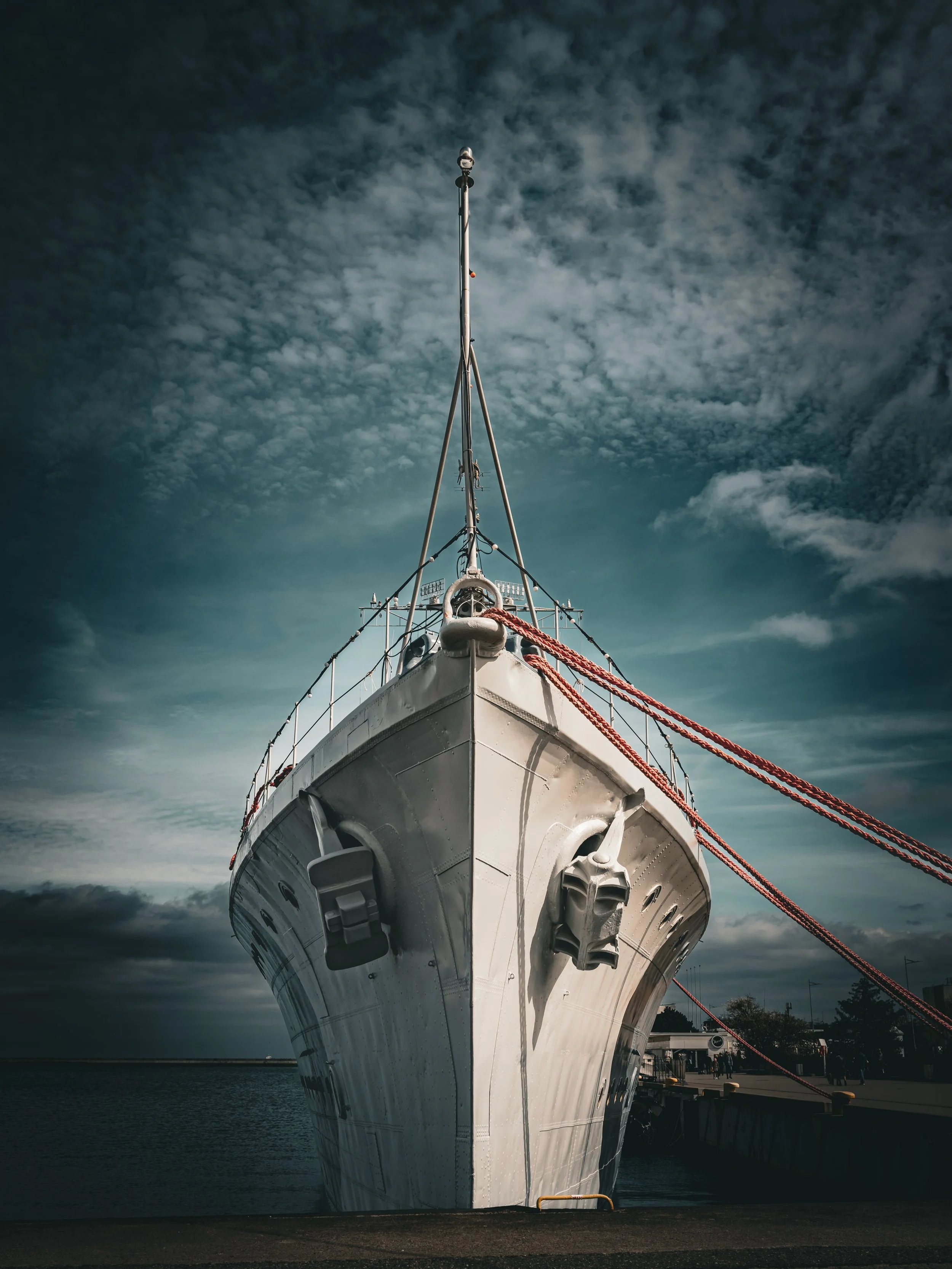 Looking up at the towering bow of a maritime icon. There is an incredible sense of scale standing right at the water&rsquo;s edge in Gdynia, where the dramatic Baltic skies perfectly mirror the raw, industrial strength of the docks.
Bringing that sig