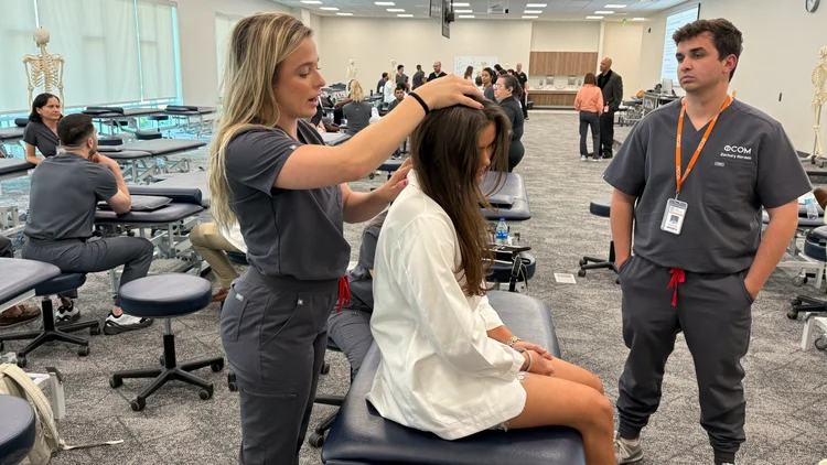 OCOM students participating in hands-on osteopathic medical education