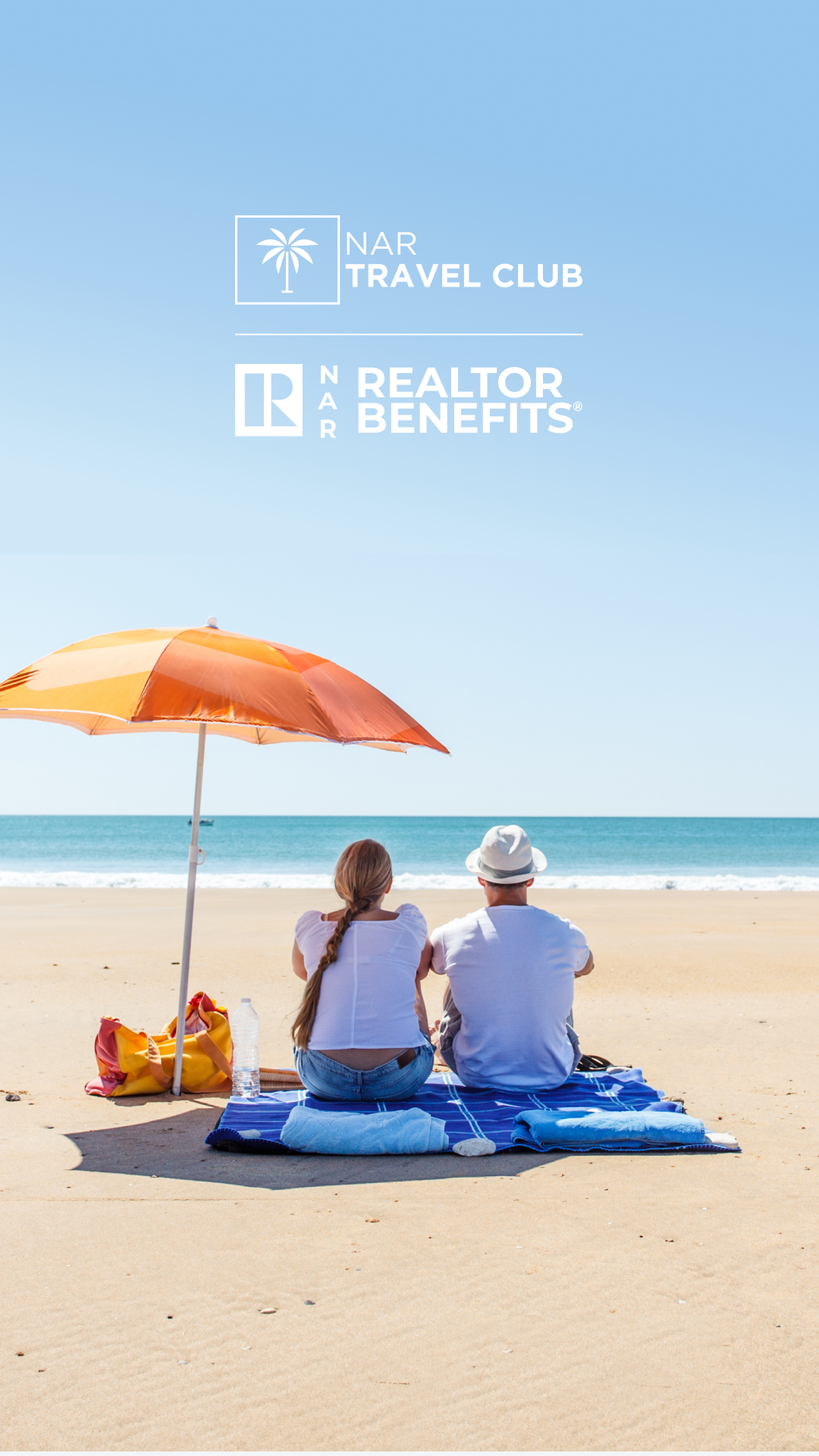 A couple sits on a beach under an orange umbrella, facing the ocean. They sit on blue mats, with a bag and water bottle beside them. Text above reads "NAR Travel Club" and "NAR Realtor Benefits" on a clear sky.