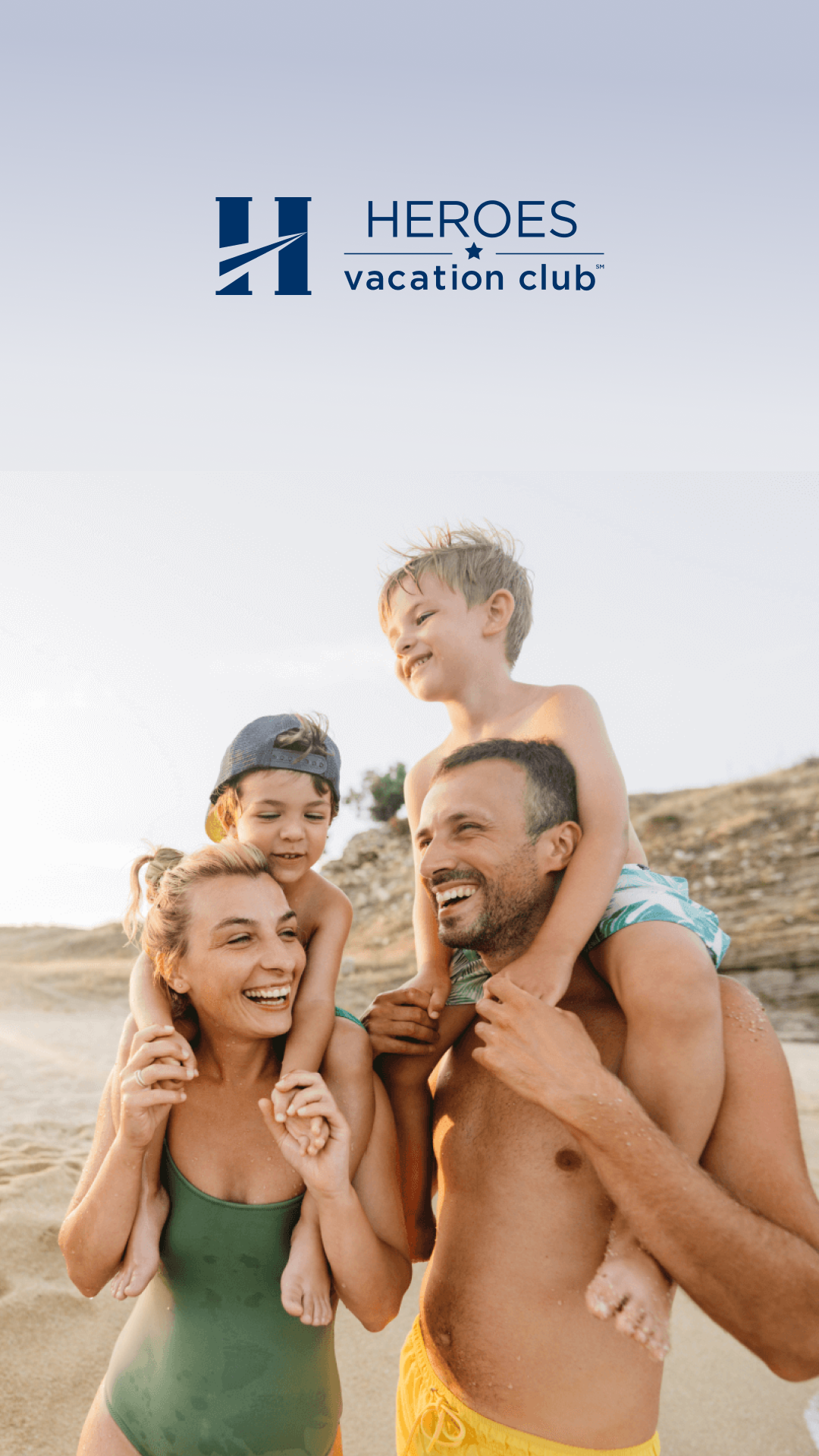 A joyful family of four enjoys a beach day with two young children on their shoulders with  "Heroes Vacation Club" logo appears above them.