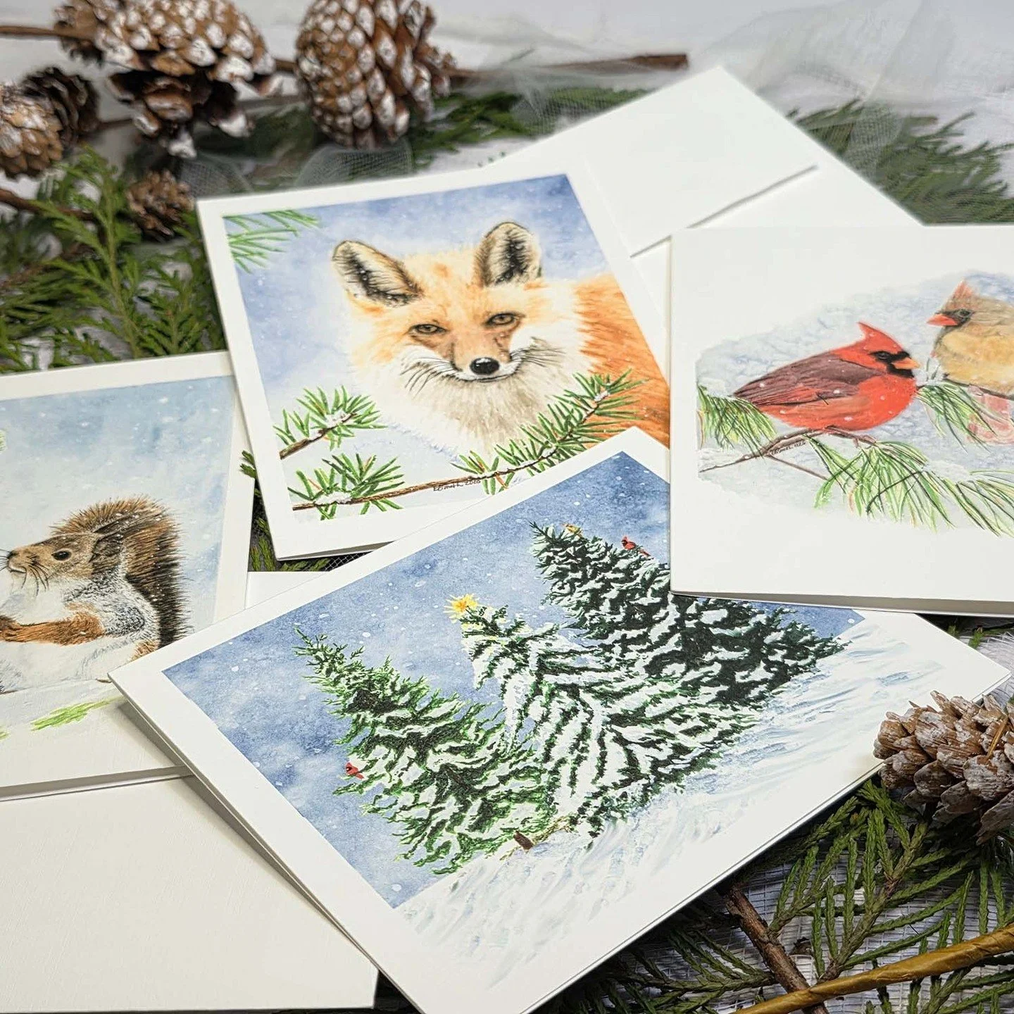 These gorgeous greeting cards are available now in the Holiday Shop (link in bio). I painted the original paintings AND print, cut, score, fold, and package the cards in the studio myself. They are available with images only or with greeting text add