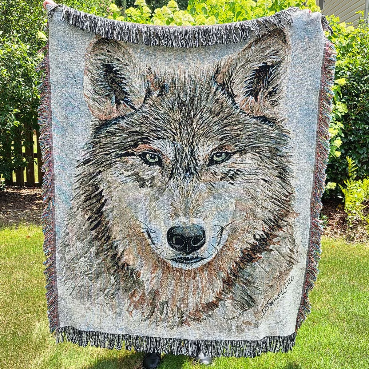 WRAP YOURSELF IN ART. Imagine settling into your favorite chair on a cool evening, wrapping yourself in a soft cotton blanket, and enjoying the beauty of nature right in your own home. My wolf watercolor painting has been intricately woven into this 