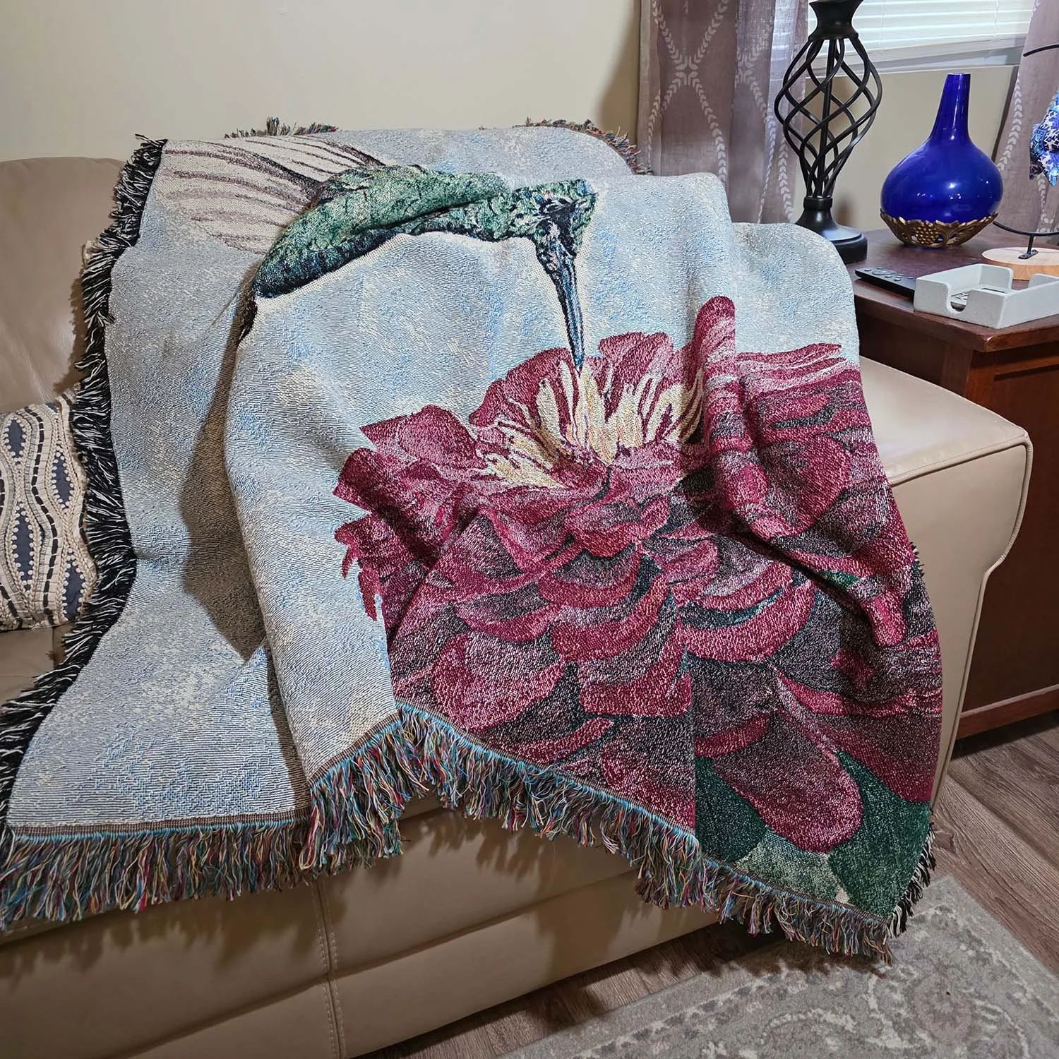 Watercolor-Hummingbird-Zinnia-Woven-Blanket-Draped-on-Sofa-MamaDuck-Art-Beth-Smith.jpg