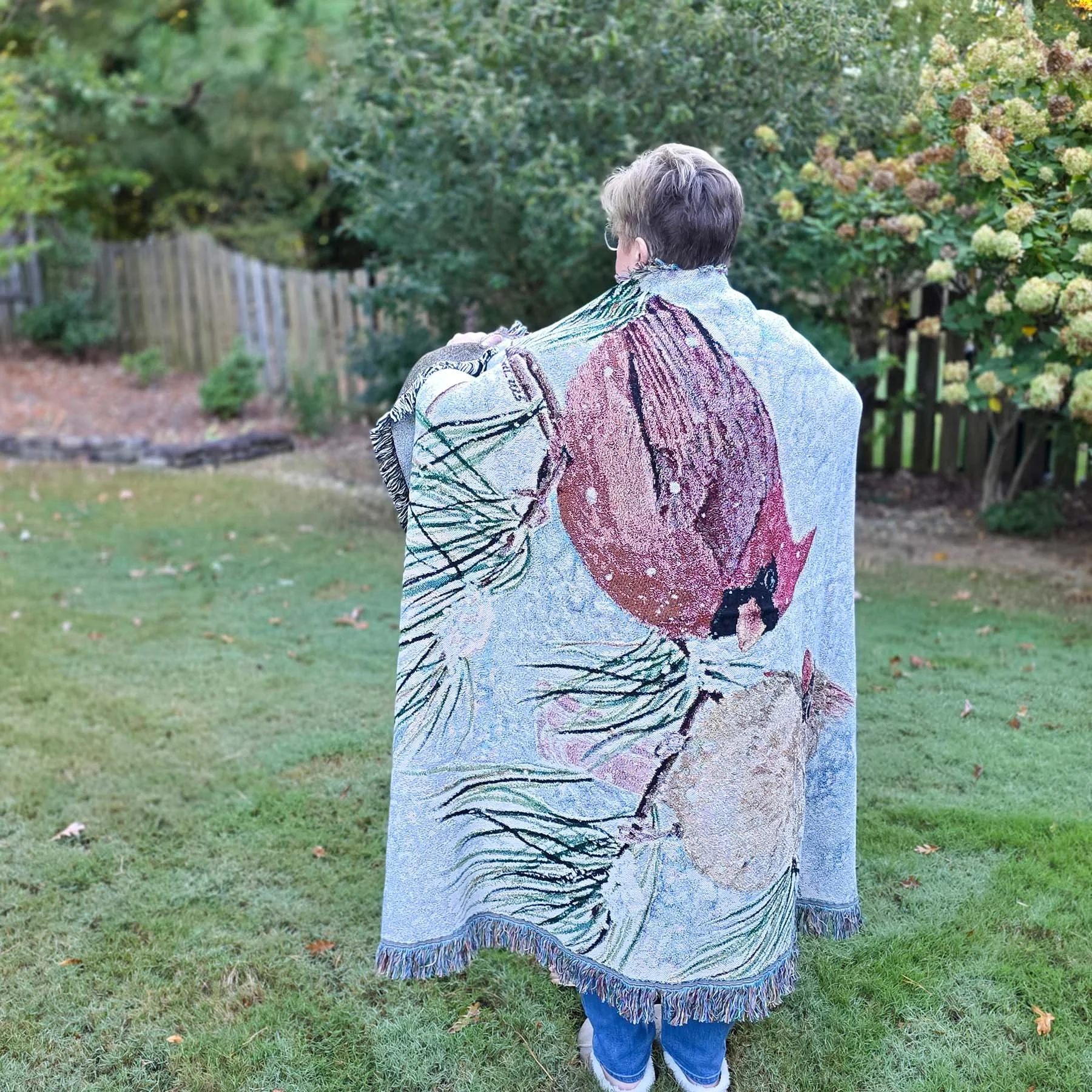 Watercolor-Cardinals-Woven-Blanket-Outside-Wrapped-Around-Woman-Sideways-MamaDuck-Art-Beth-Smith.jpg