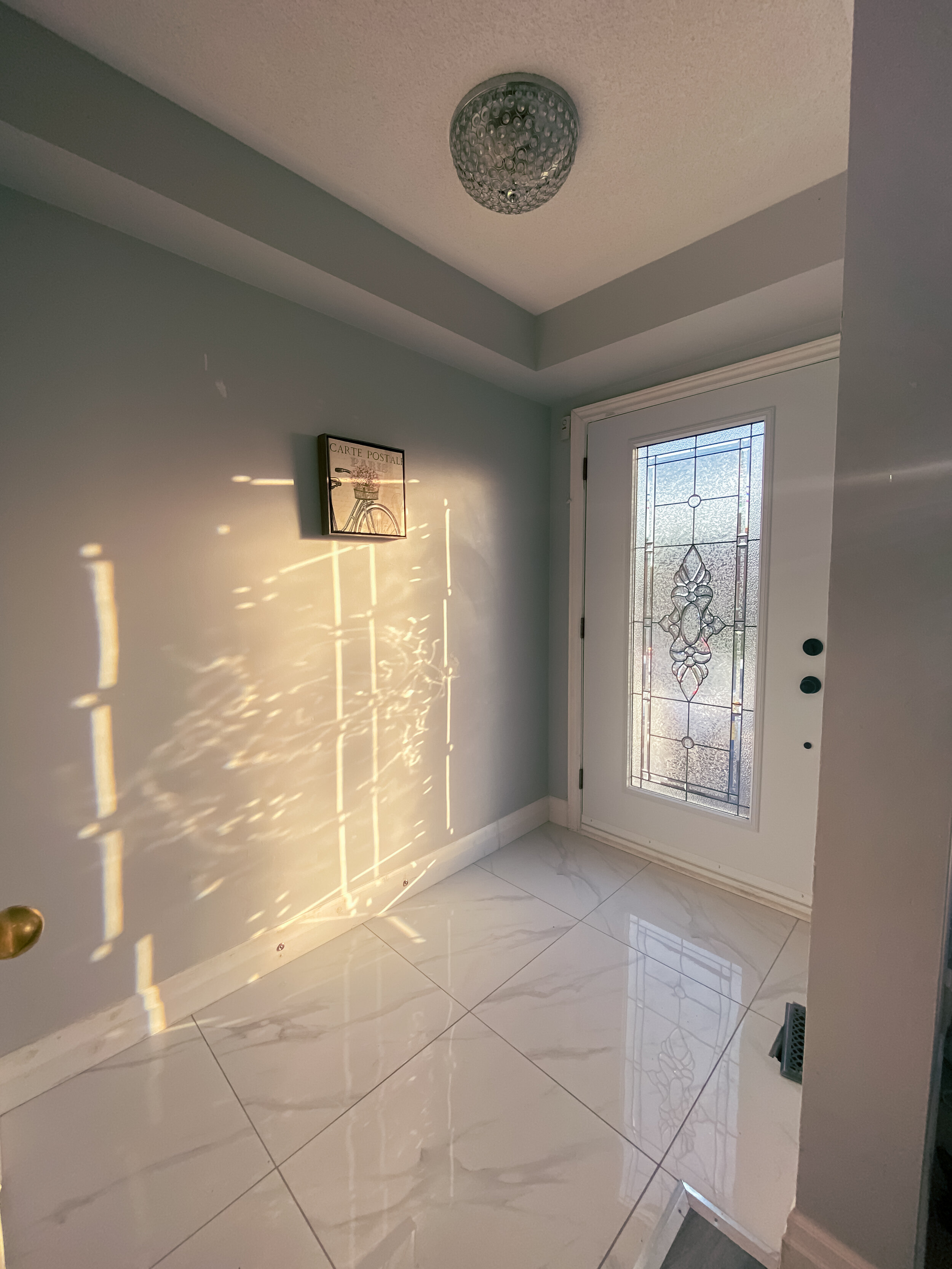 Entryway tiles & door installation.