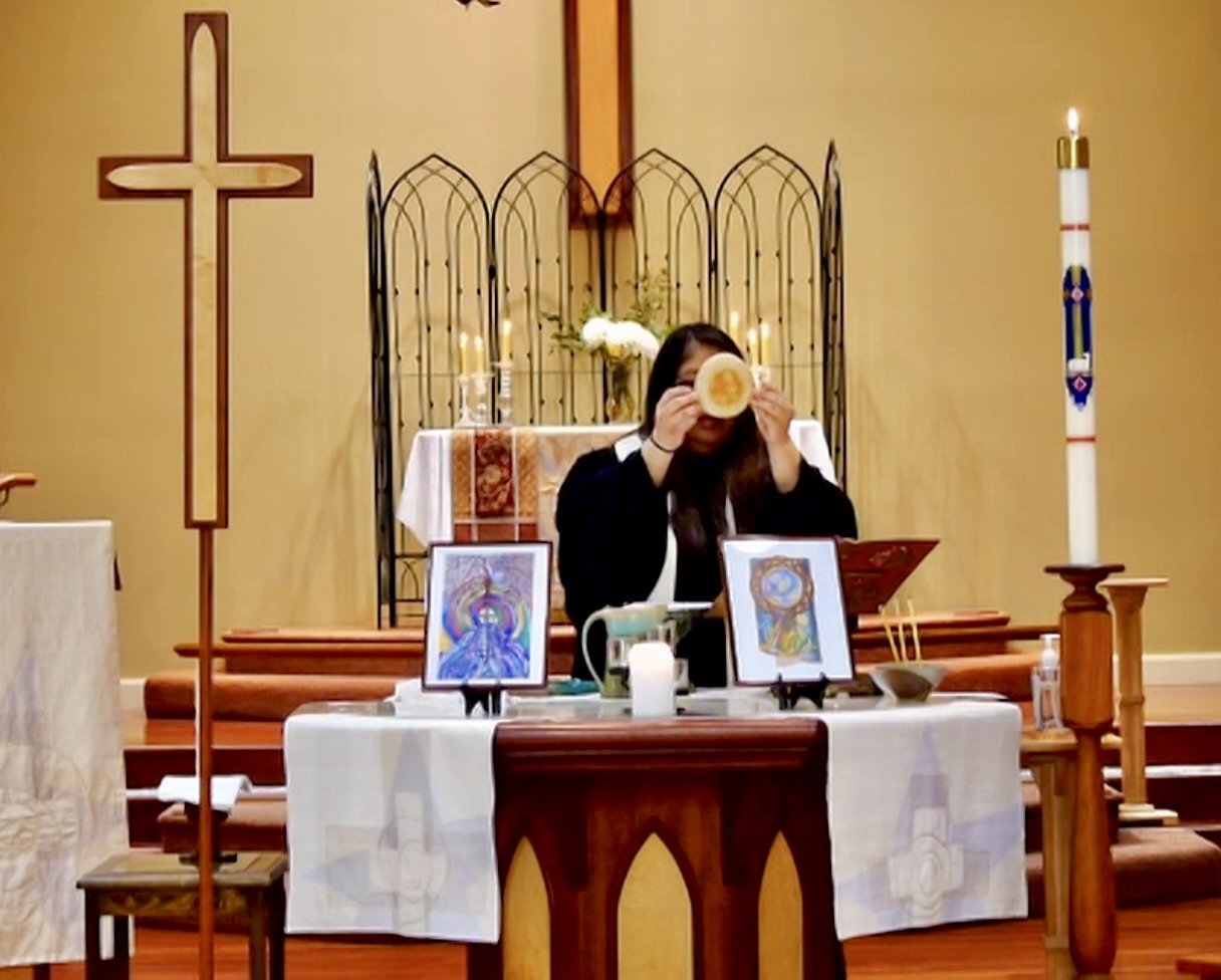 Rev. Lisa presiding over Holy Communion