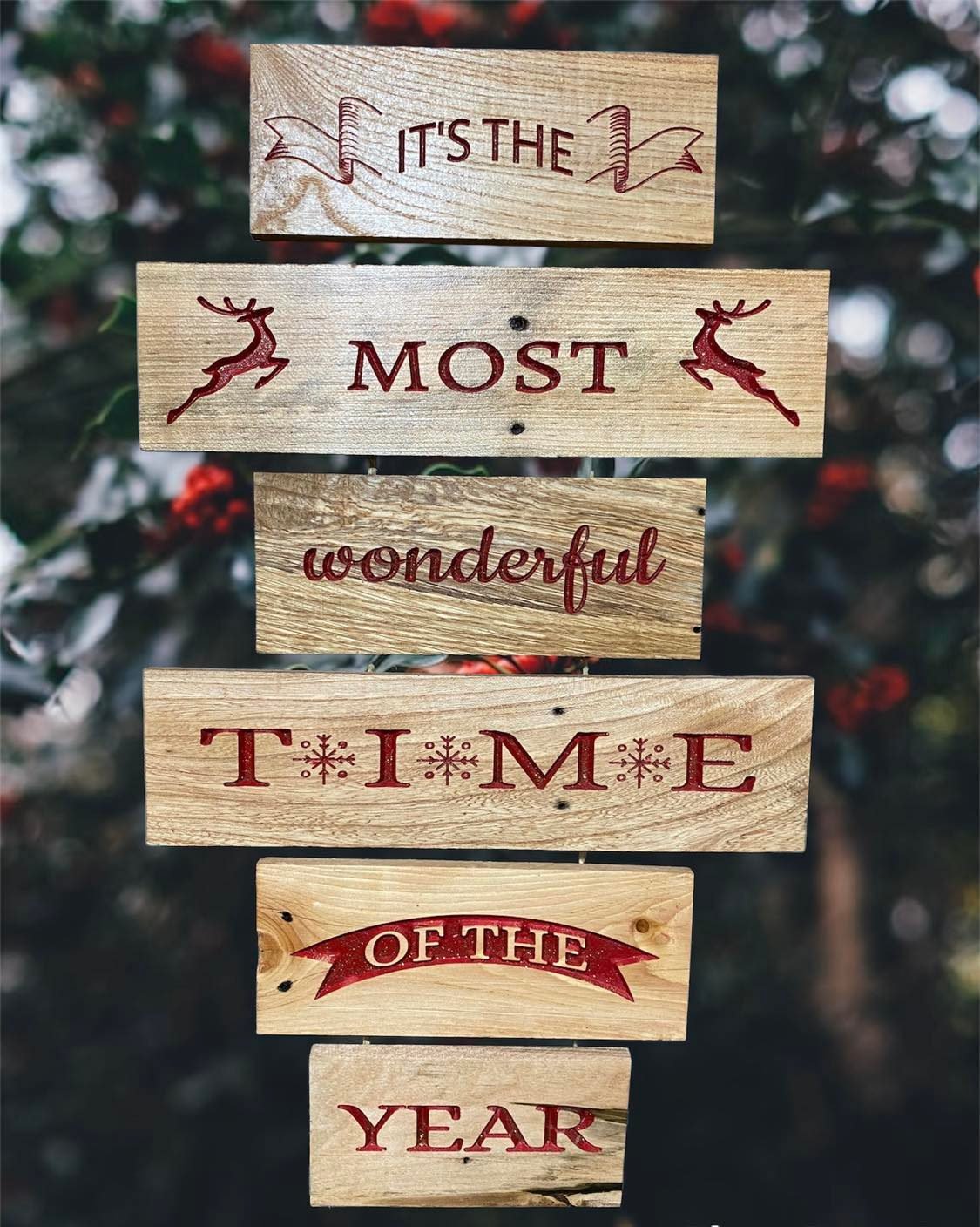The Most Wonderful Time of the Year festive wall hanging measures approx. 12" x 18" made out of refurbished pallet wood. A great addition to your holiday décor.