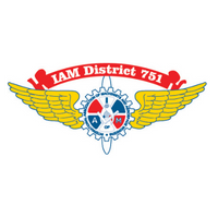 Logo of IAM District 751 with wings, featuring a blue gear and two red wings, and the text 'IAM District 751' on a red banner.
