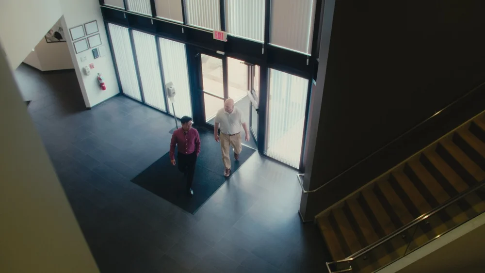 Overhead cinematic shot of Calyx office lobby entrance