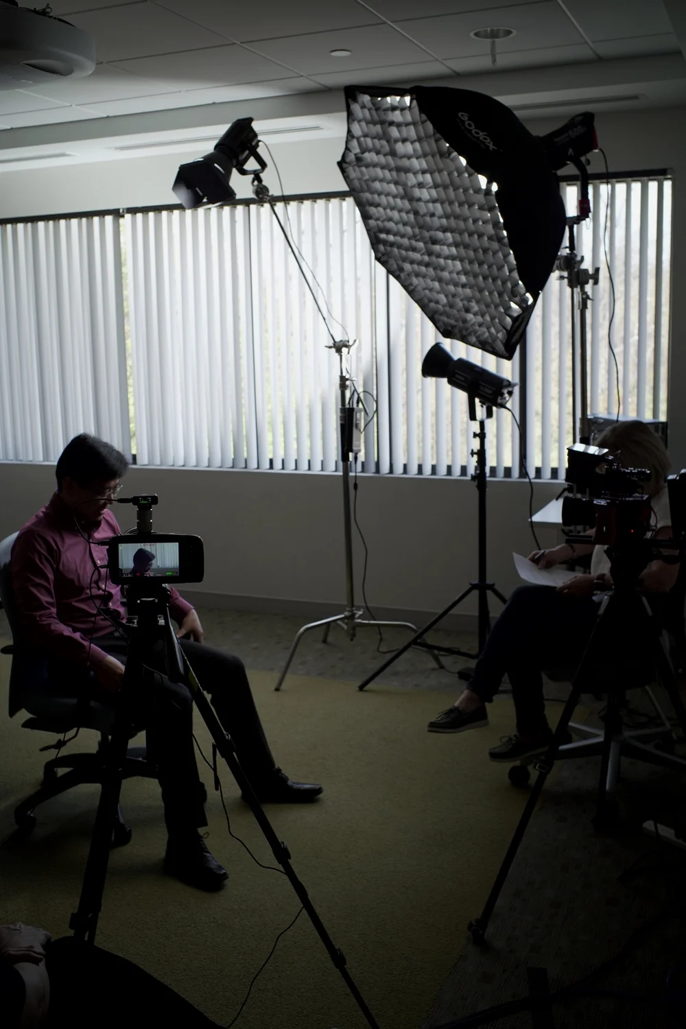 Professional lighting setup for clinical researcher interview at Calyx