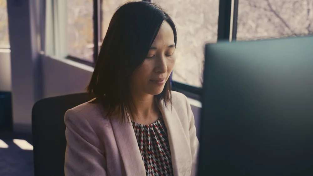 Calyx principal scientist at workstation during cinematic b-roll filming