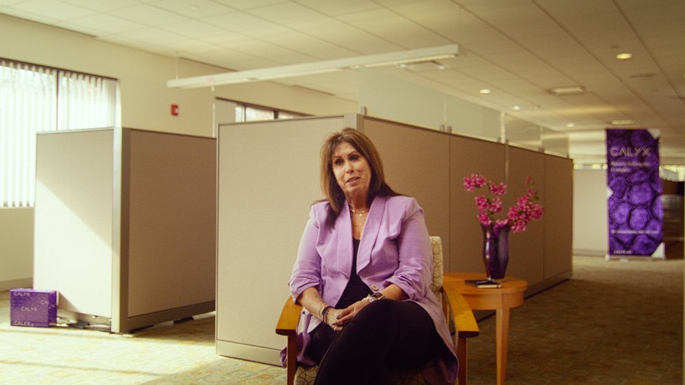 Calyx executive interview with branded office environment and Calyx signage