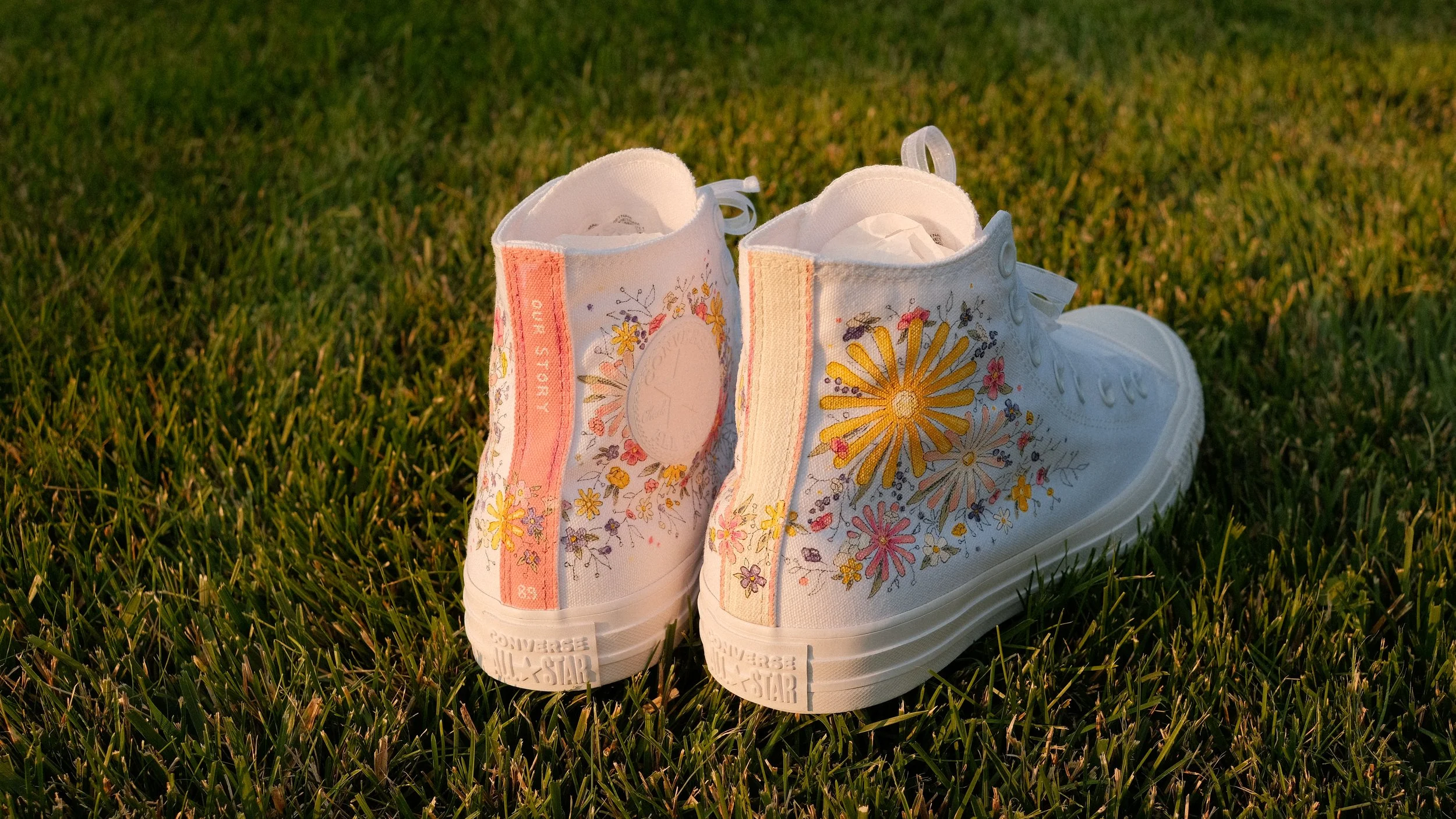 Custom painted shoes for my cousin's wife to wear at their wedding. Inspired by her decor that included book stacks and colorful wildflowers