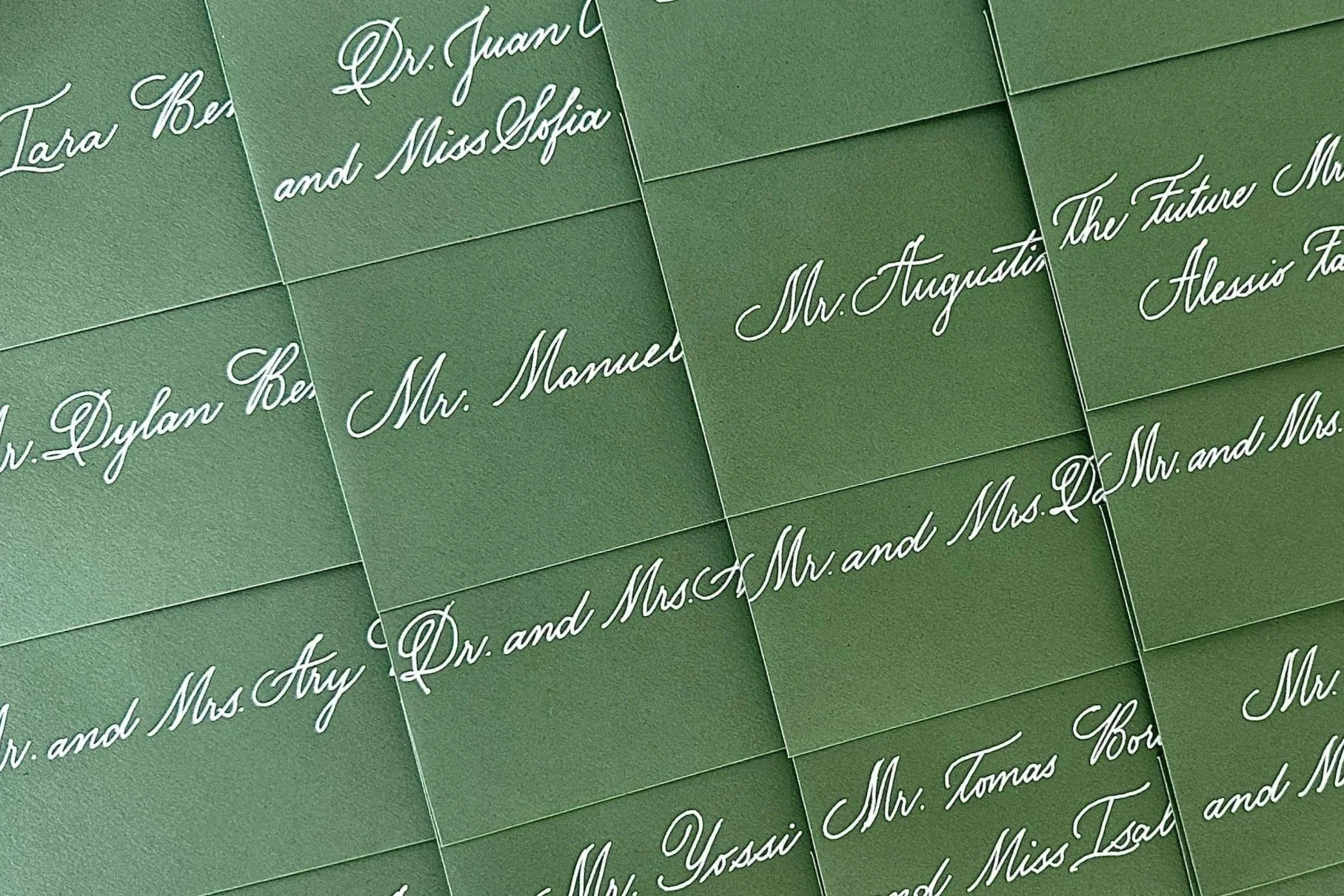 Green Envelope with White ink calligraphy by Miami Calligrapher Sanique
