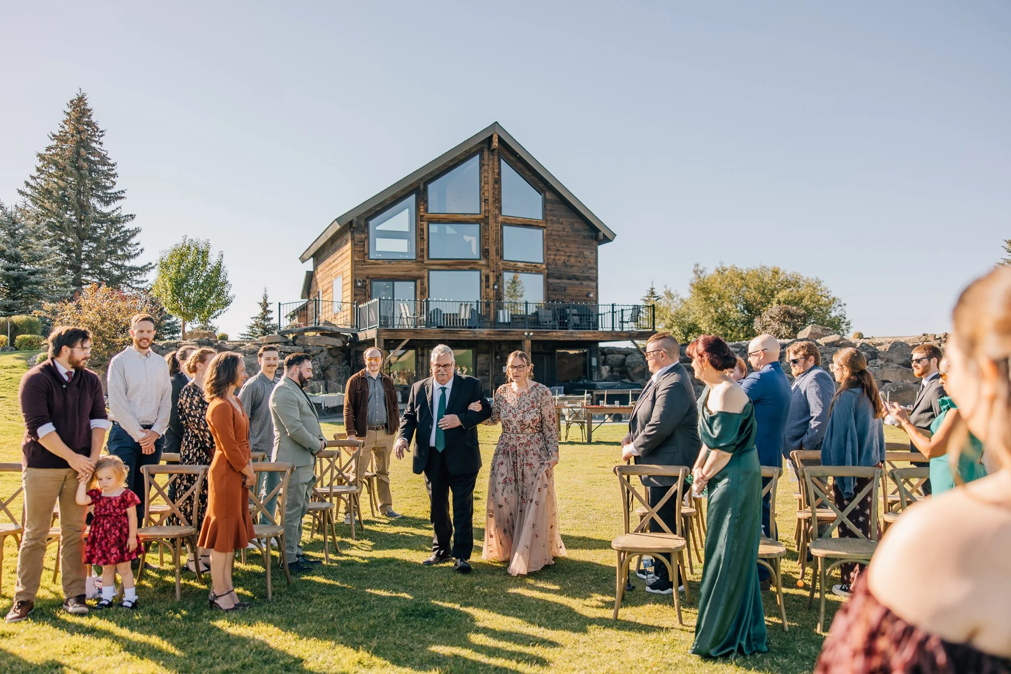 Groom being tossed in the air by his groomsmen shot by Laura at Blooming Studios