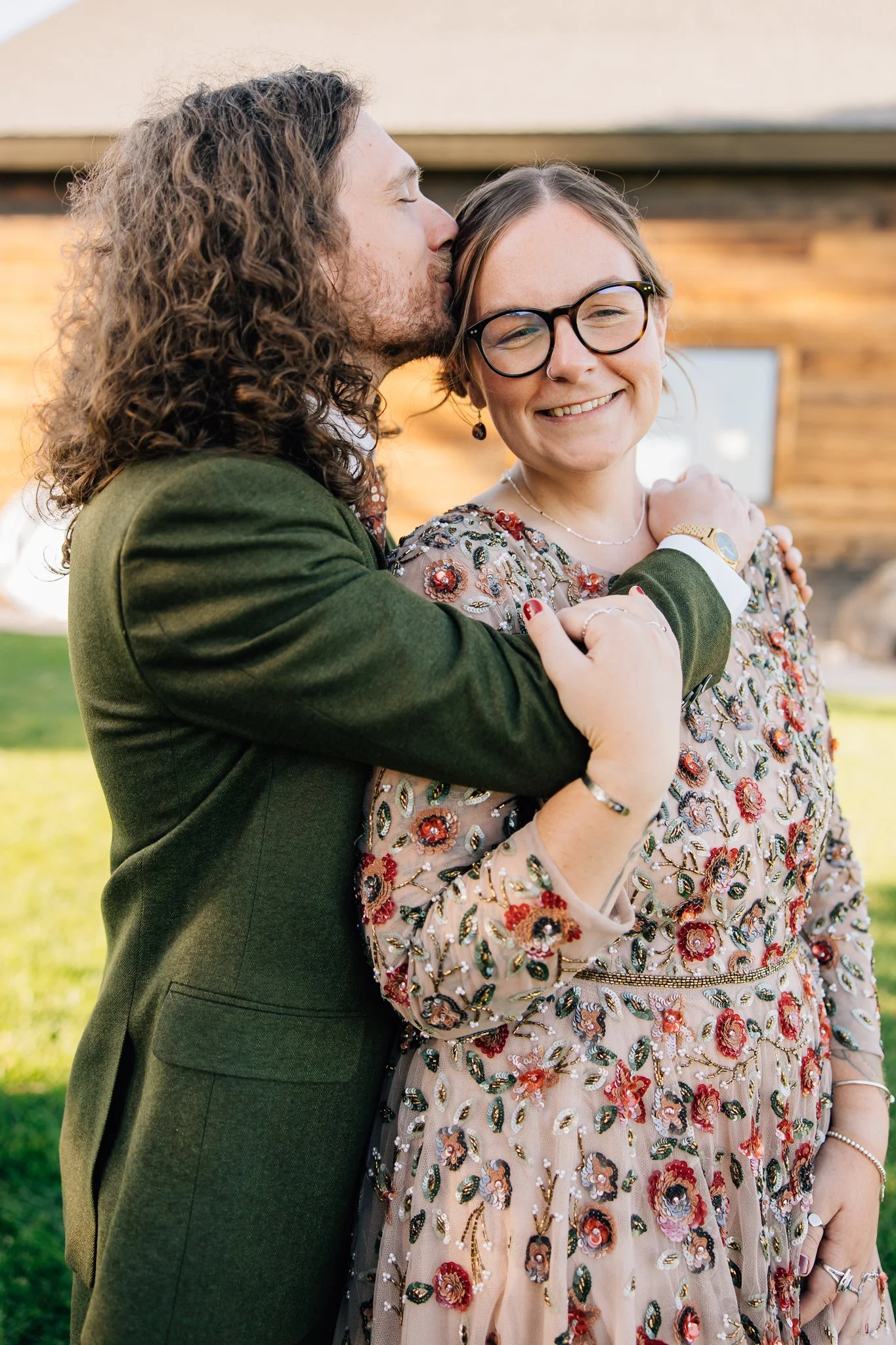 Engaged couple embracing shot by Laura at Blooming Studios