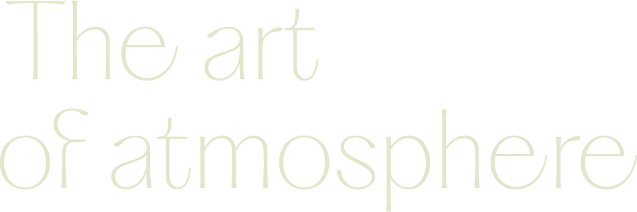 Close-up of the phrase "The art of atmosphere" in light-colored text on a black background
