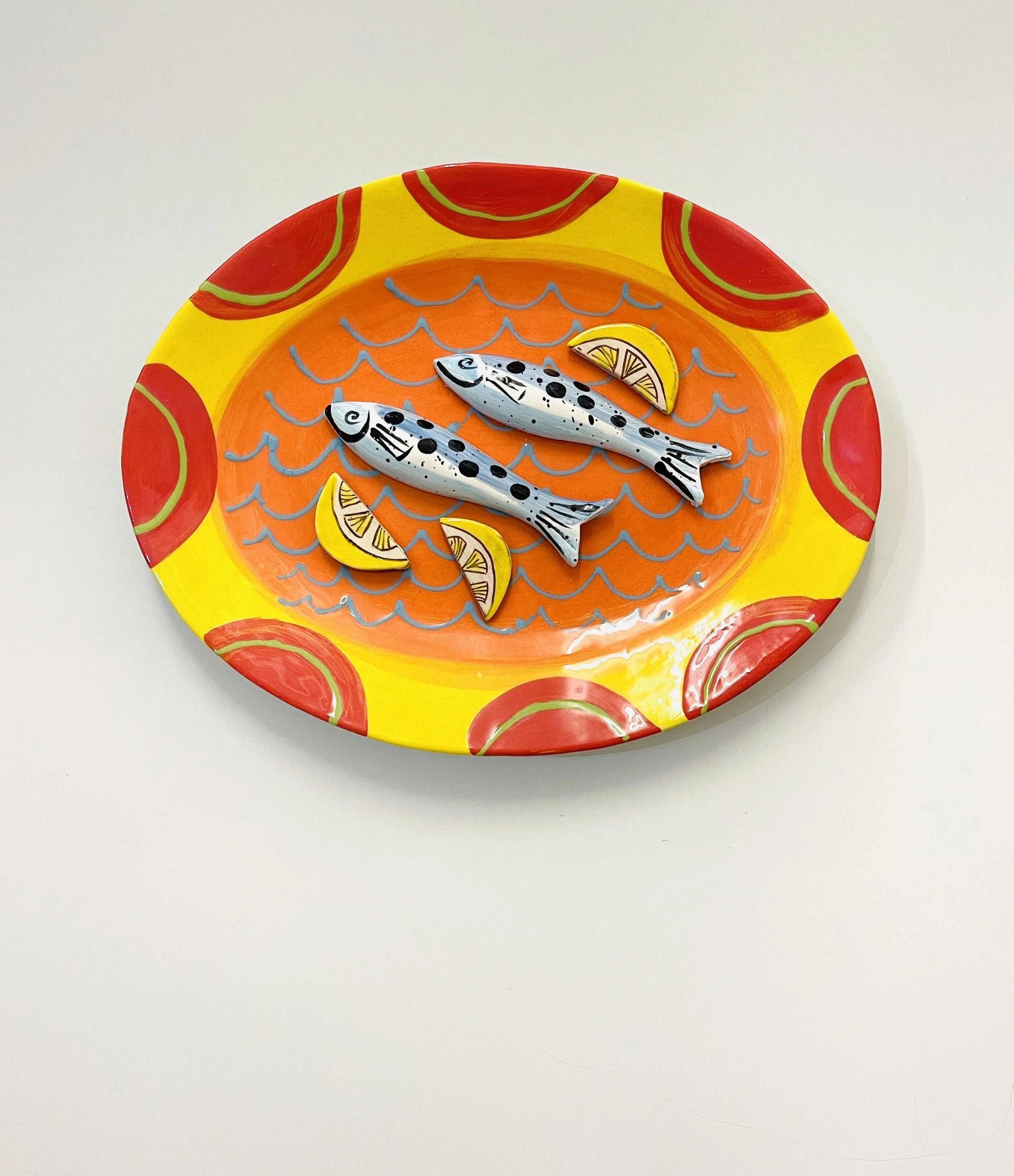 Two fish and lemon slices.
Orange and yellow.
Large earthenware wall platter
£295.00
