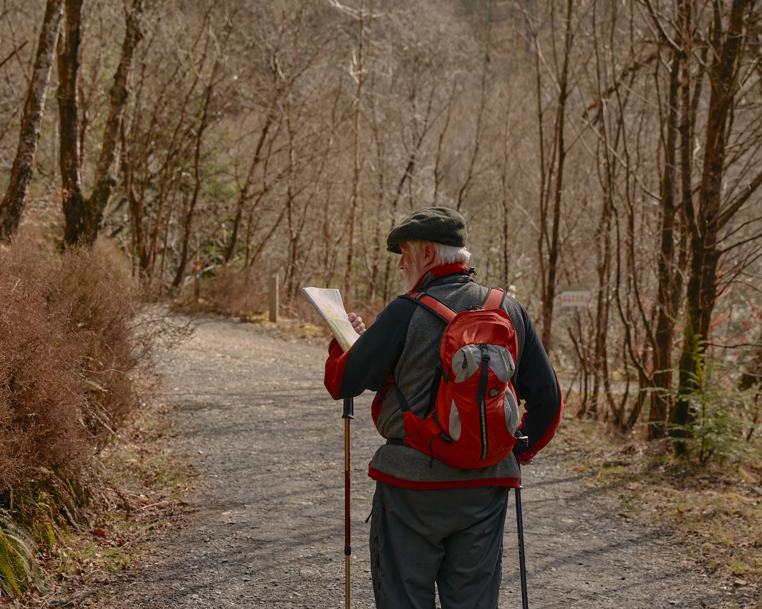 A man reads a map in Wales, UK.