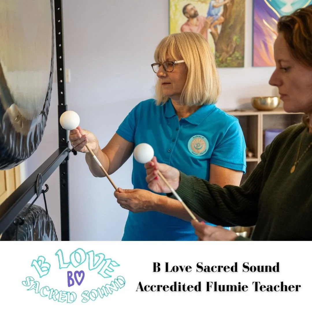 The tutor, Helen, showing a student the correct way to hold the gong flumie. 
Helen is a B Love Flumie accredited teacher.