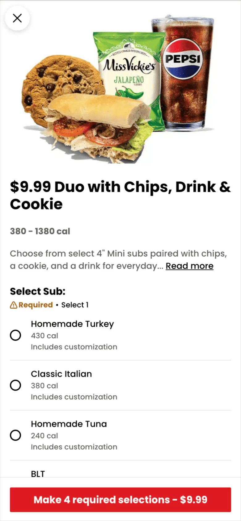 A sandwich with turkey, lettuce, tomato, and onion in a bun, next to a chocolate chip cookie, a bag of Miss Vickie's Jalapeno chips, and a glass of Pepsi with ice.