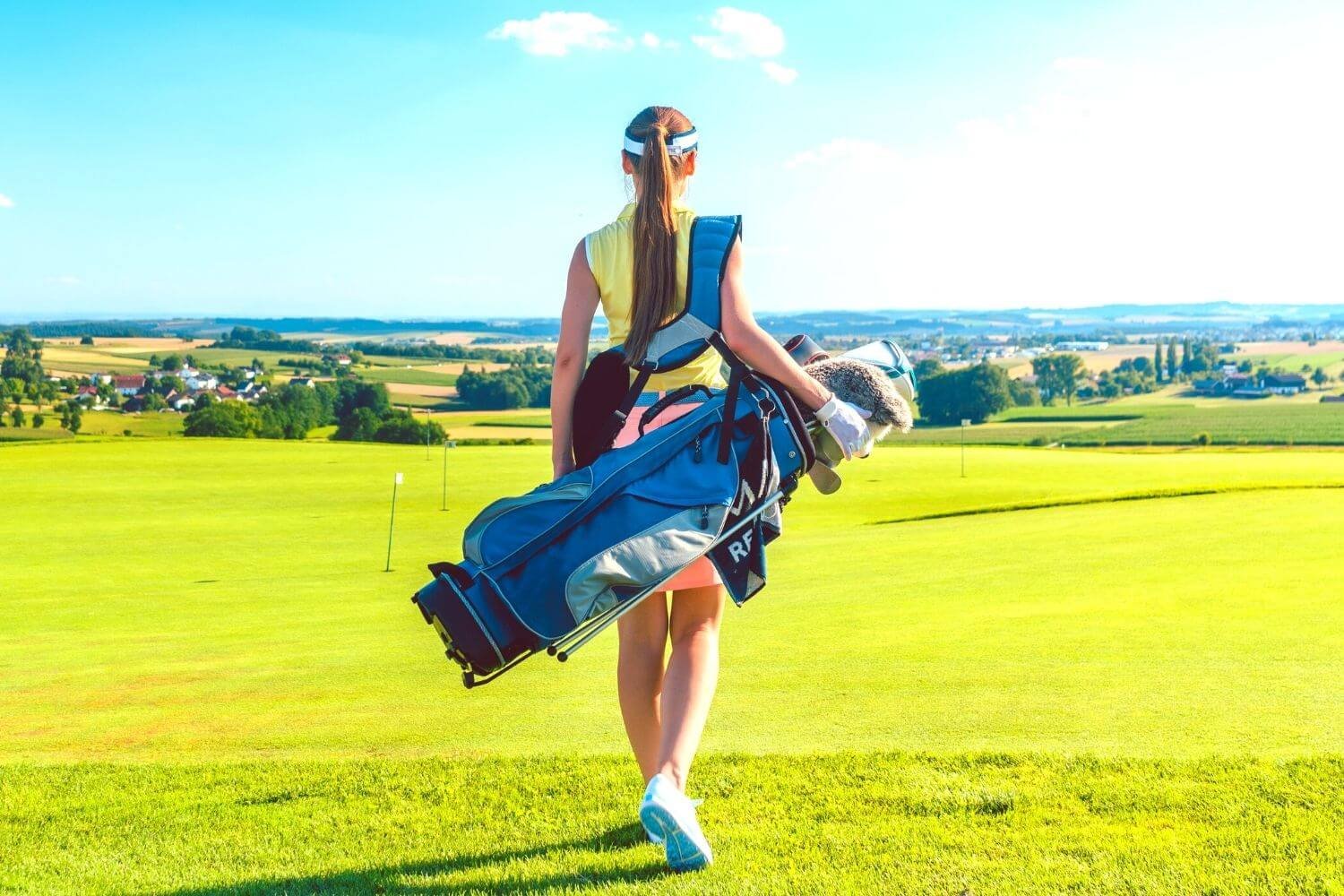 Female golfer holding a trendy golf bag