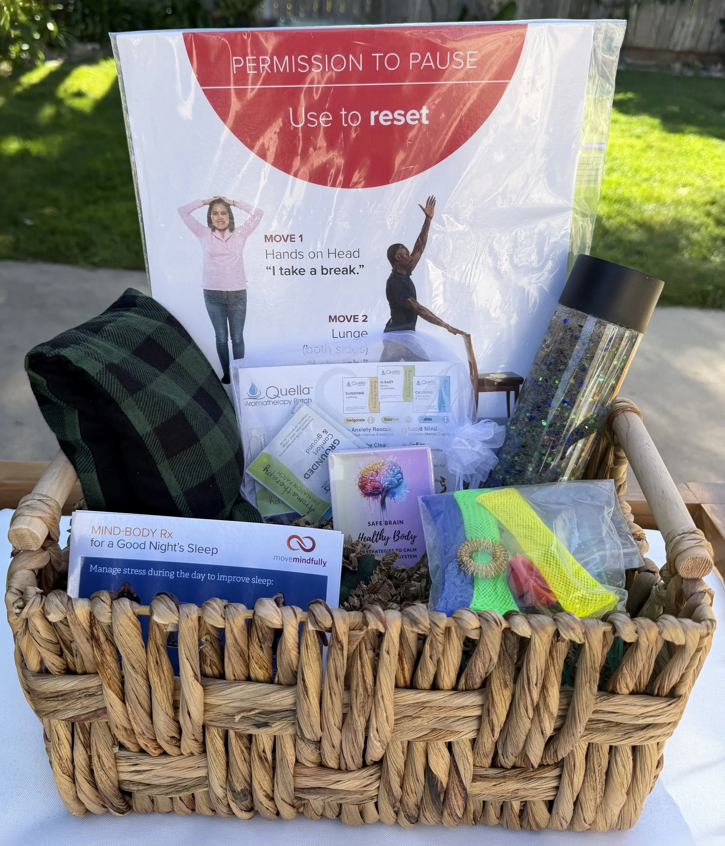 Basket filled with sensory items - weighted neck wrap, fidgets, aromatherapy and more
