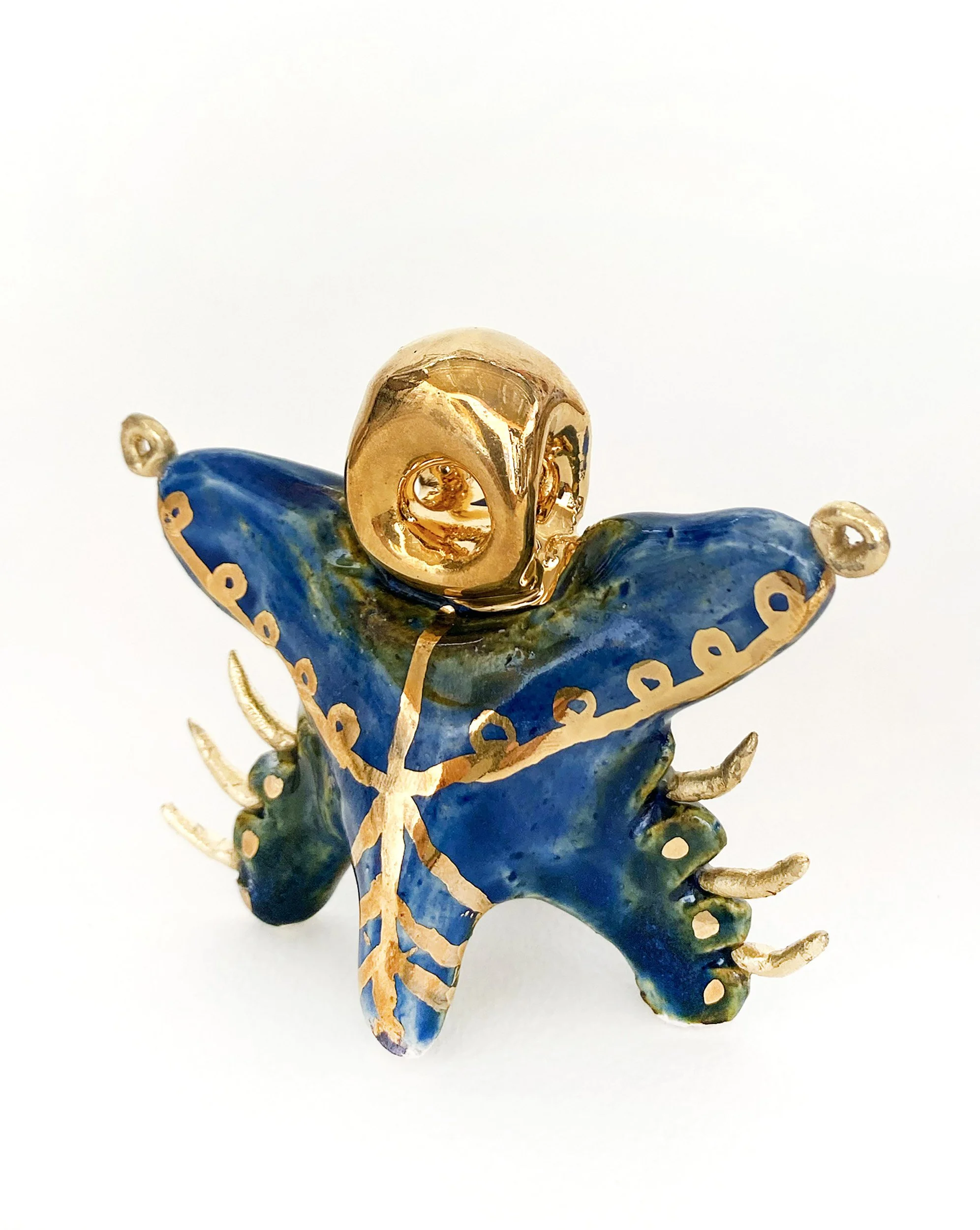 "Lar #6", 2024, 3x3x3in., glazed stoneware, luster, plastic and 24k gold leaf