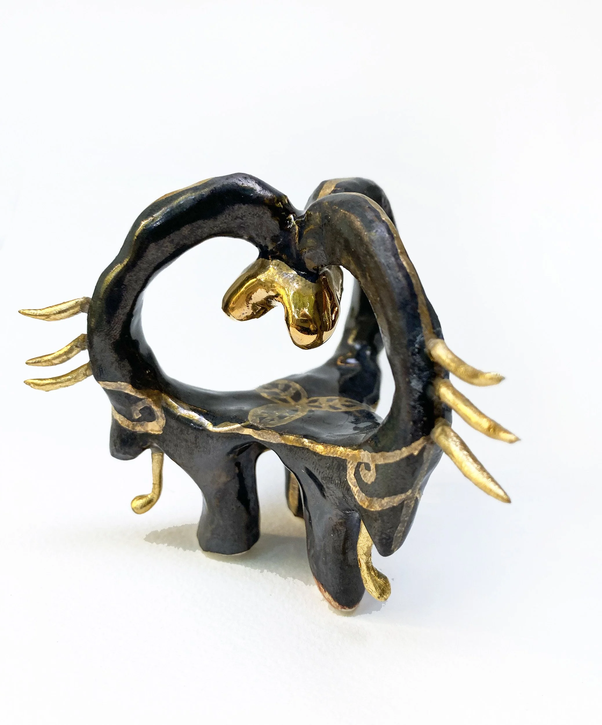"Lar #4", 2024, 3x3x3in., glazed stoneware, luster, plastic and 24k gold leaf