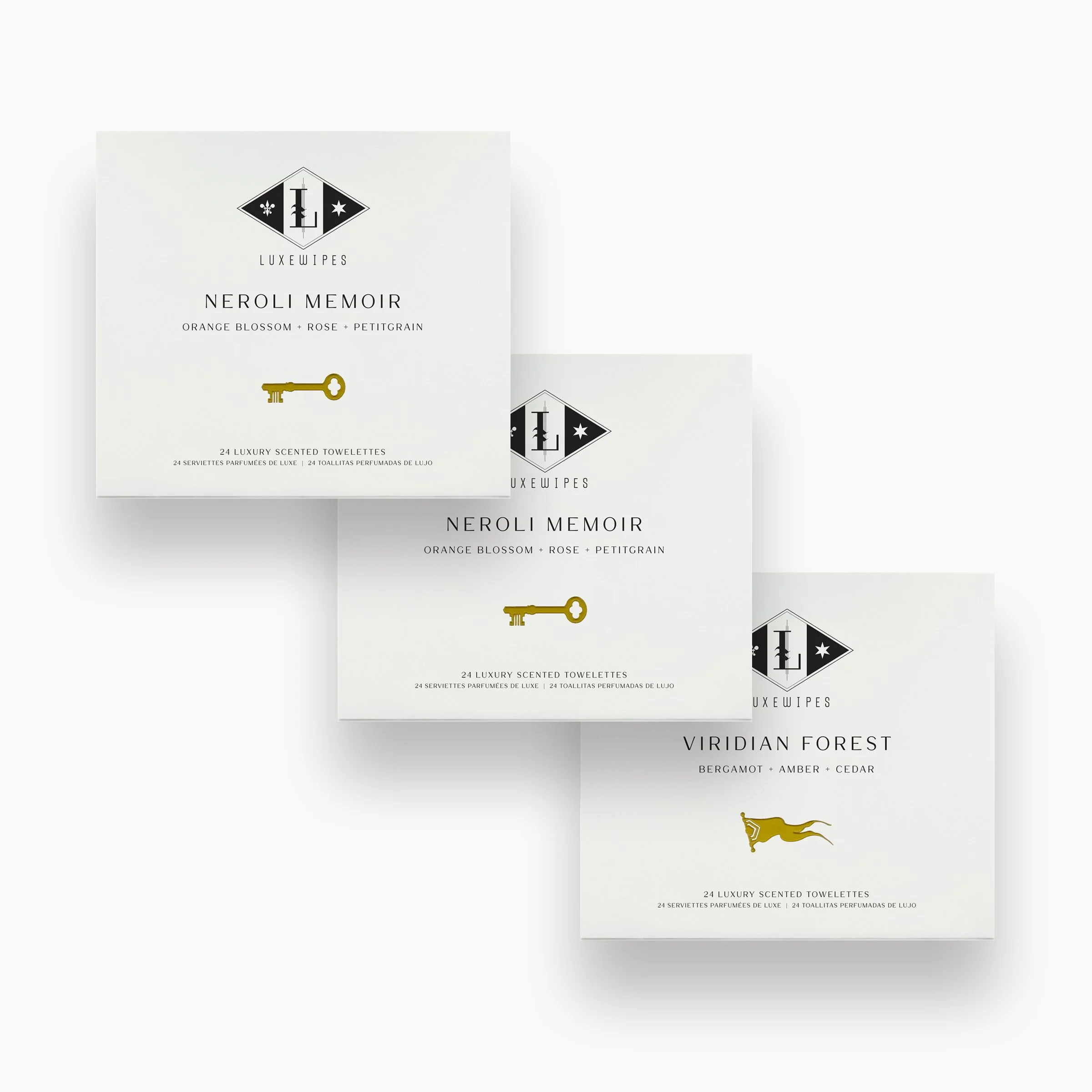 Front view of two LUXEWIPES Neroli Memoir boxes, and one Viridian Forest box, each featuring 24 individually wrapped oxford-woven cotton wet wipes. Perfect for conscious luxury and self-care.