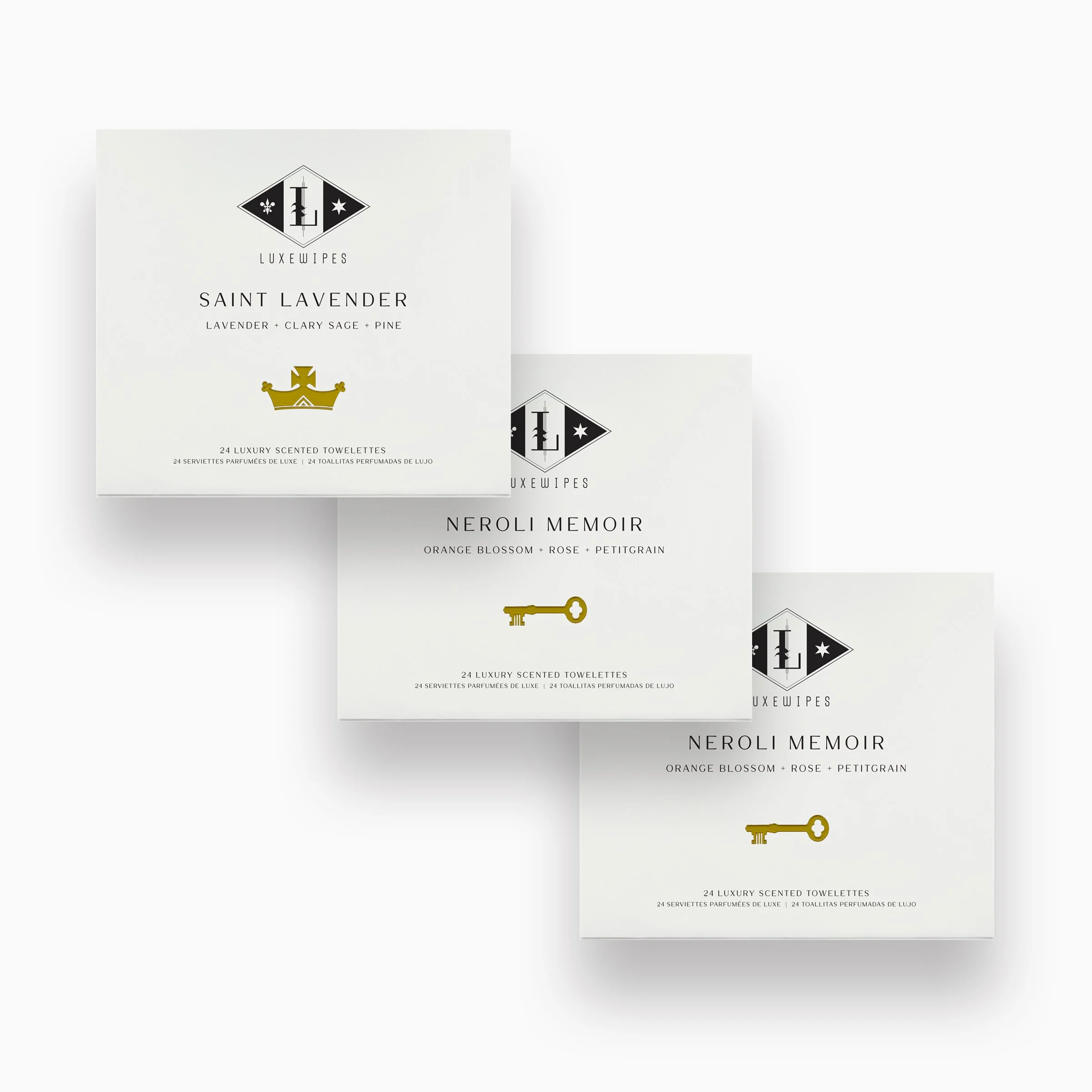 Front view of LUXEWIPES Saint Lavender, and two Neroli Memoir boxes, each with 24 individually wrapped oxford-woven cotton wet cleansing wipes. Designed for premium gifting and self-care.