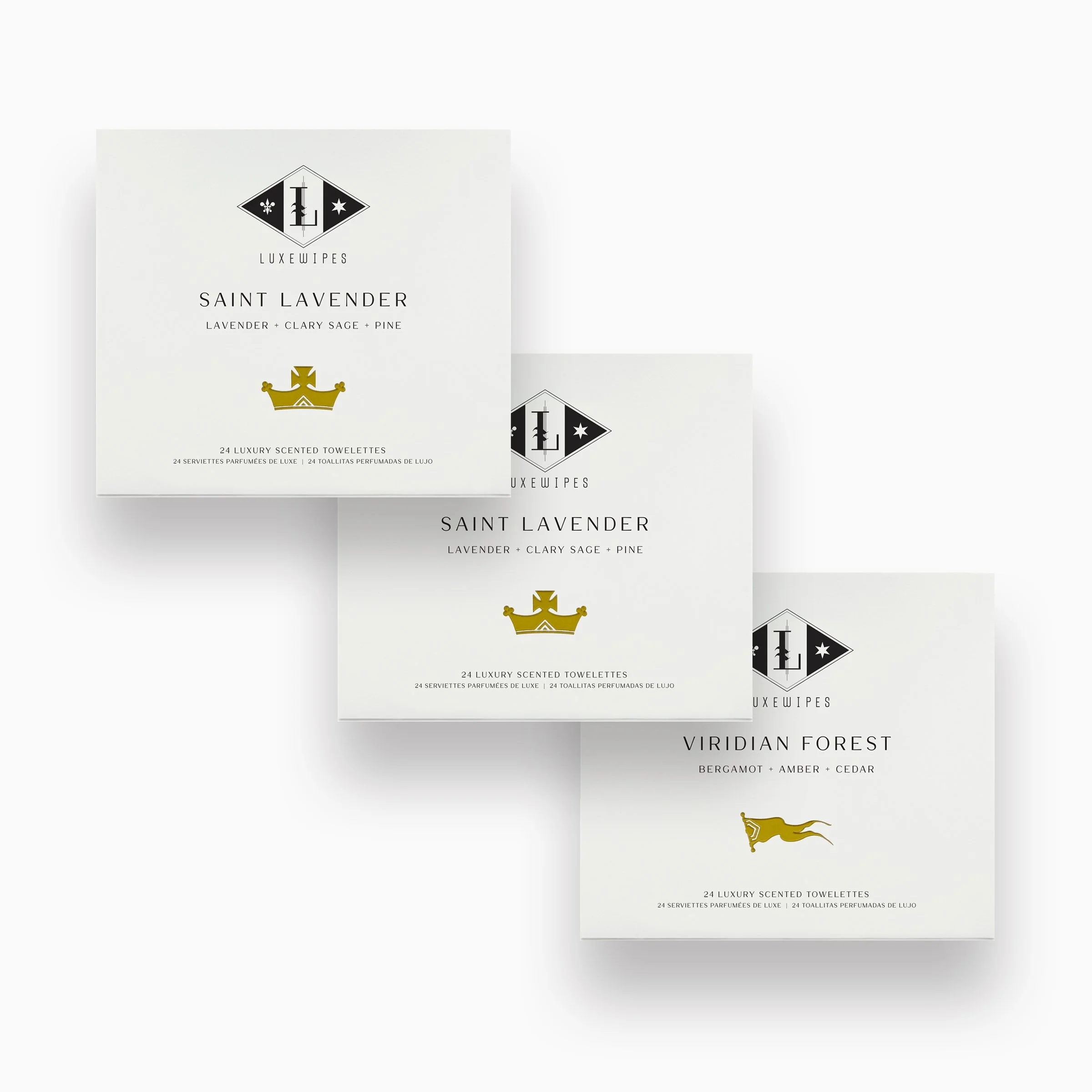 Front view of two LUXEWIPES Saint Lavender boxes and one Viridian Forest box, each with 24 individually wrapped oxford-woven cotton wet wipes. Fine European fragrances and elevated self-care.