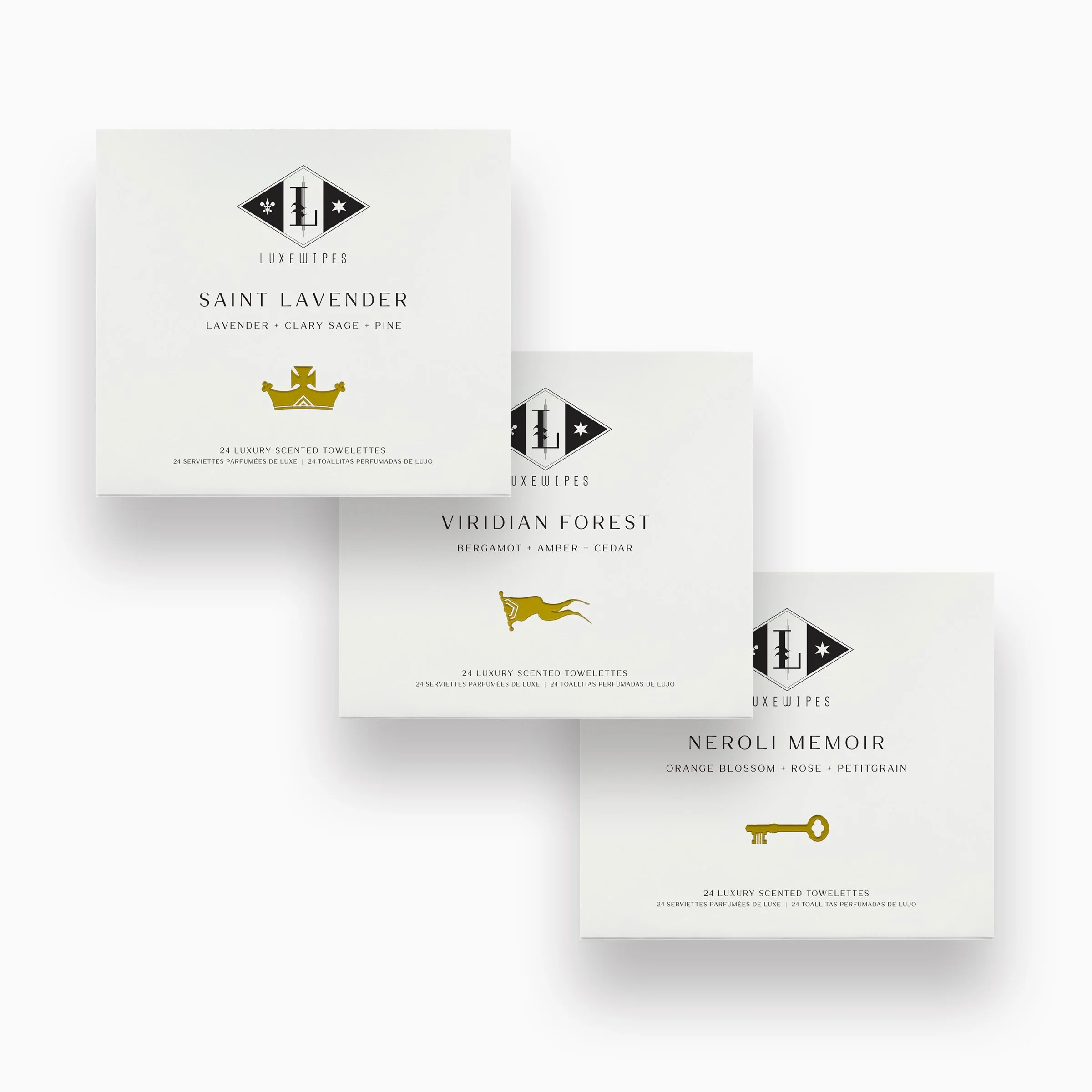 Front view of LUXEWIPES Saint Lavender, Viridian Forest, and Neroli Memoir boxes, each with 24 individually wrapped oxford-woven cotton wet cleansing wipes. Premium self-care and luxurious gifting.