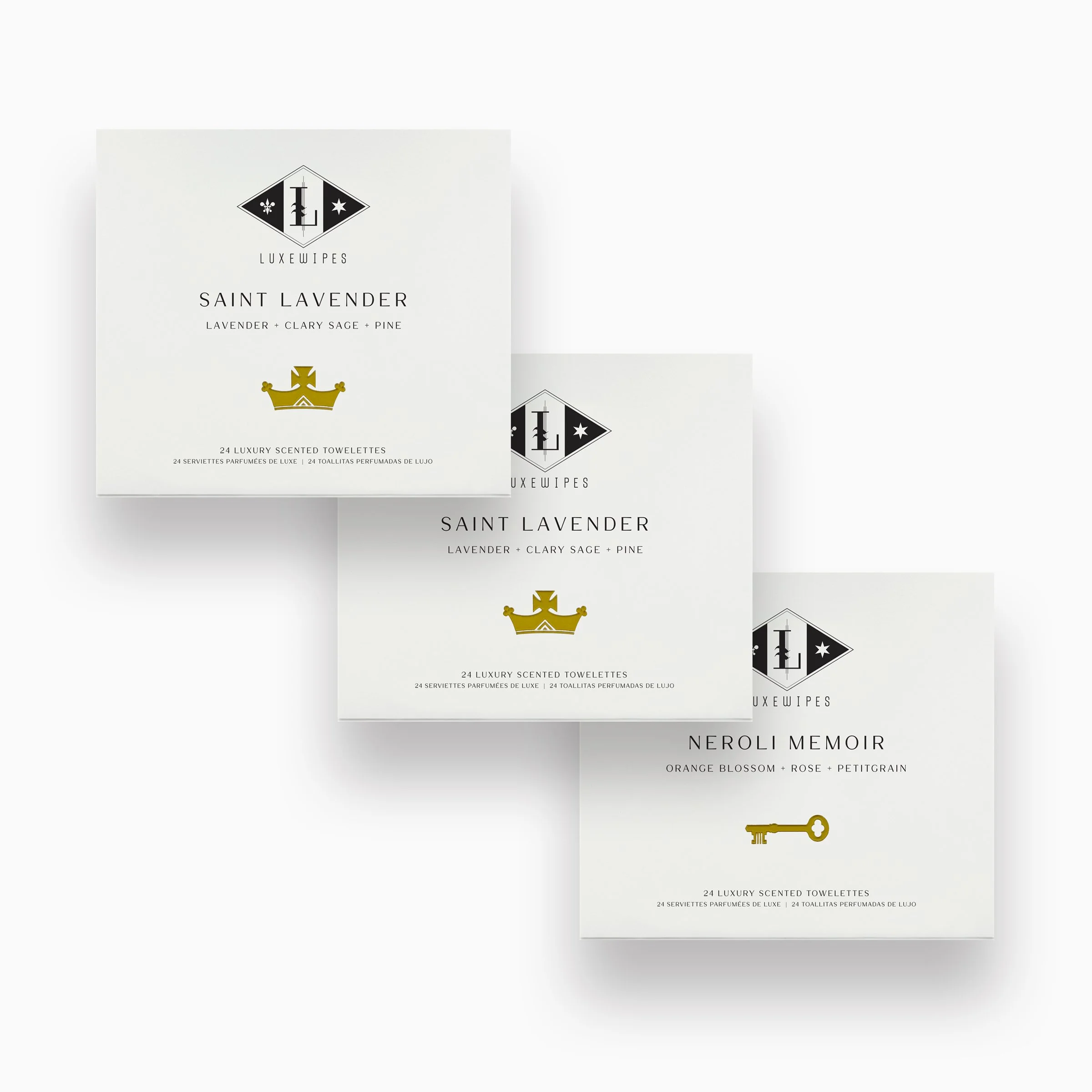Front view of two LUXEWIPES Saint Lavender boxes and one Neroli Memoir box, each featuring 24 individually wrapped oxford-woven cotton wet cleansing wipes for a mini spa-like retreat.