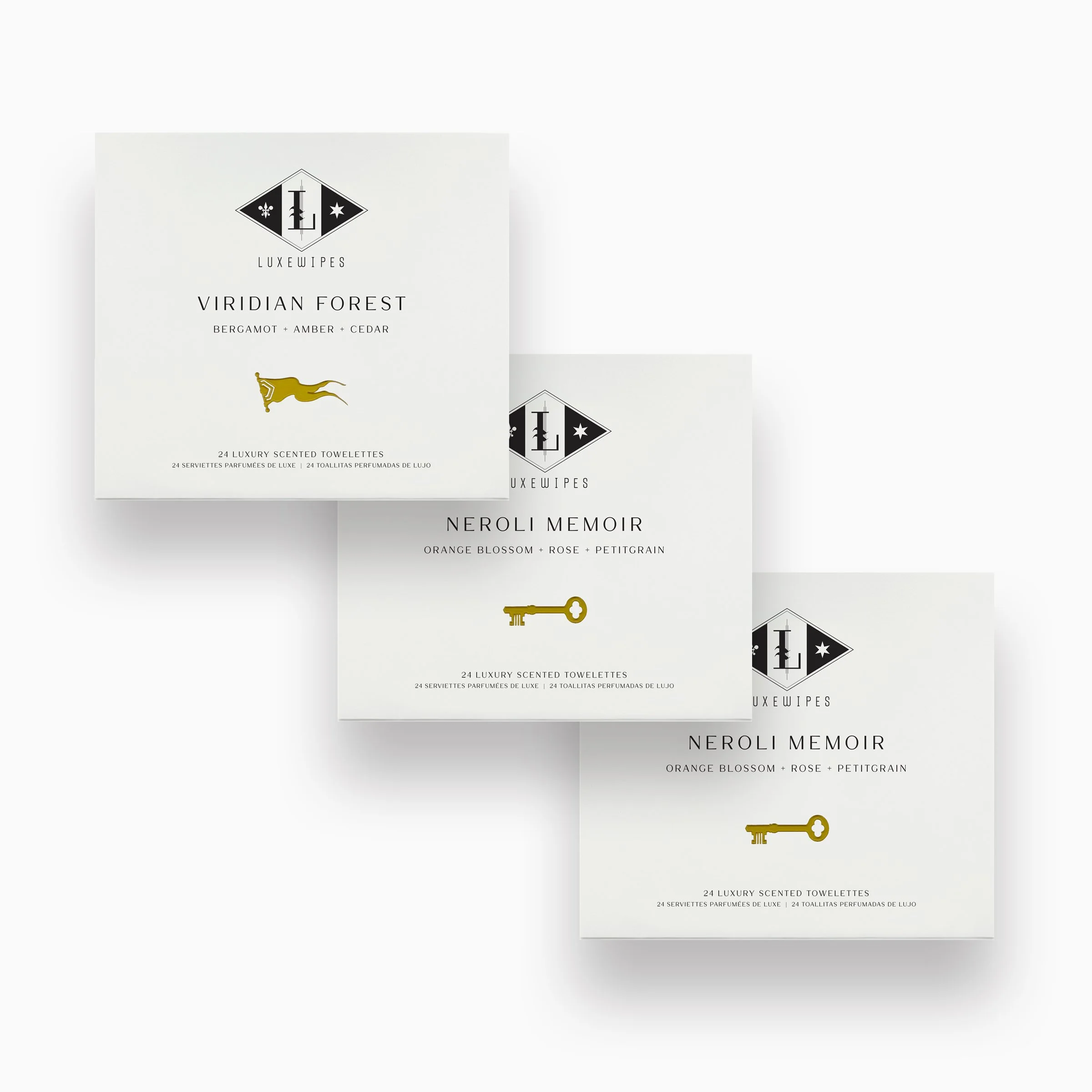 Front view of LUXEWIPES Viridian Forest, and two Neroli Memoir boxes, each containing 24 individually wrapped oxford-woven cotton wet wipes. Elevate your self-care routine.