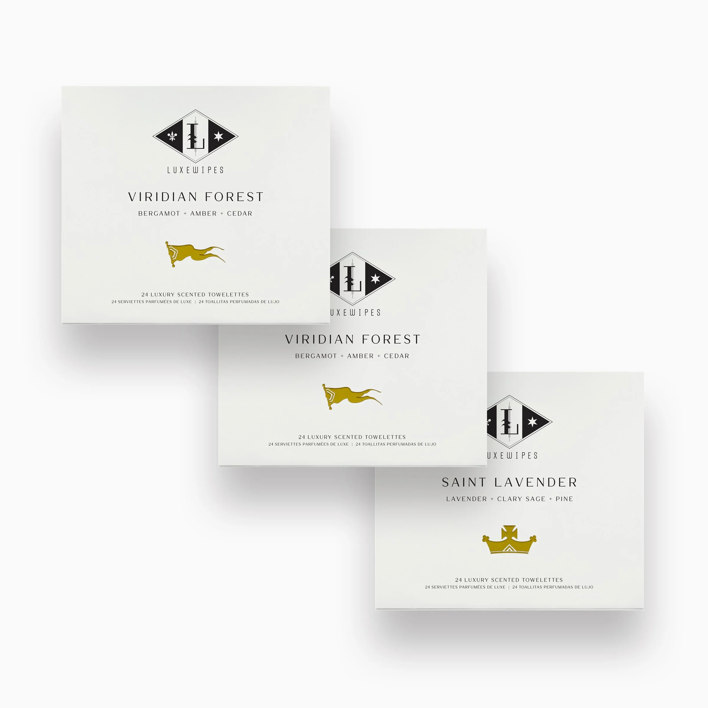 Front view of two LUXEWIPES Viridian Forest boxes and one Saint Lavender box, each containing 24 individually wrapped oxford-woven cotton moist towelettes for elevated personal care.