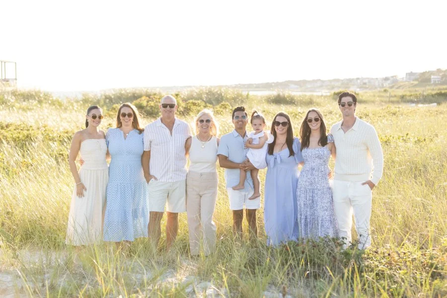 12-Three-generations-smiling-together-during-Cape-Cod-beach-portraits.jpg