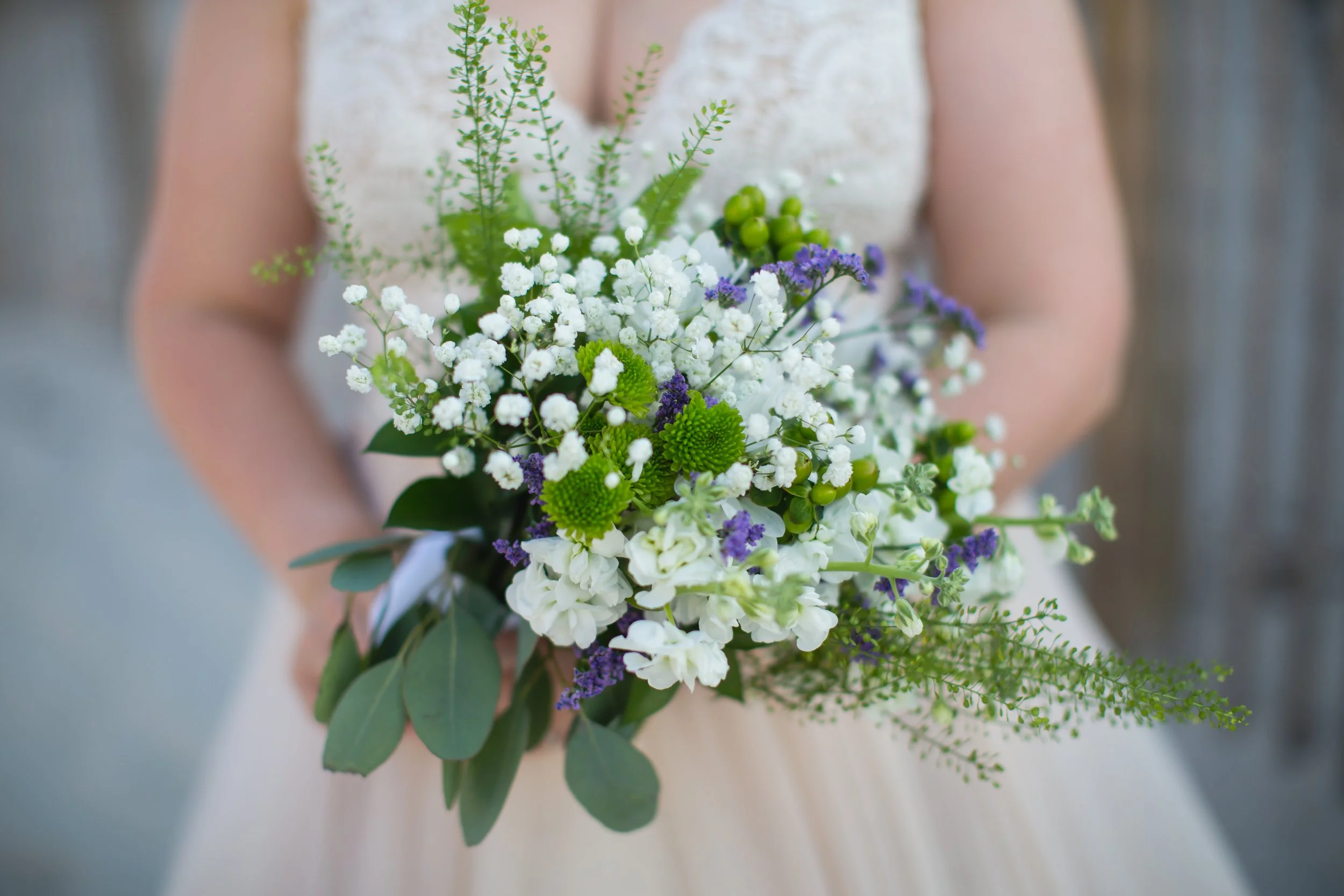 Bridal bouquet wedding dress closeup