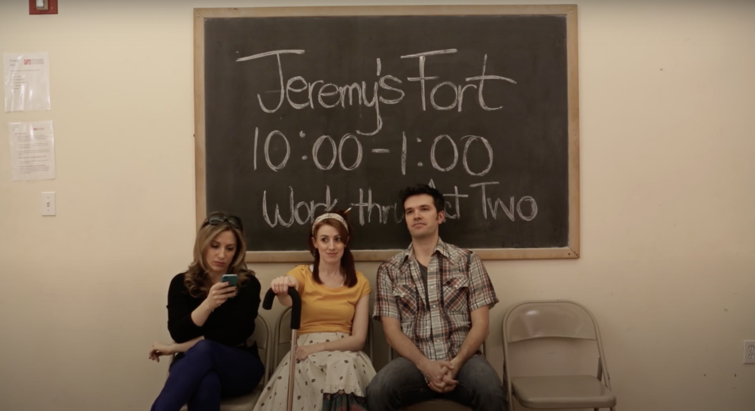 The cast of the show-within-a-show “Jeremy’s Fort,” waits patiently for rehearsals to begin.
