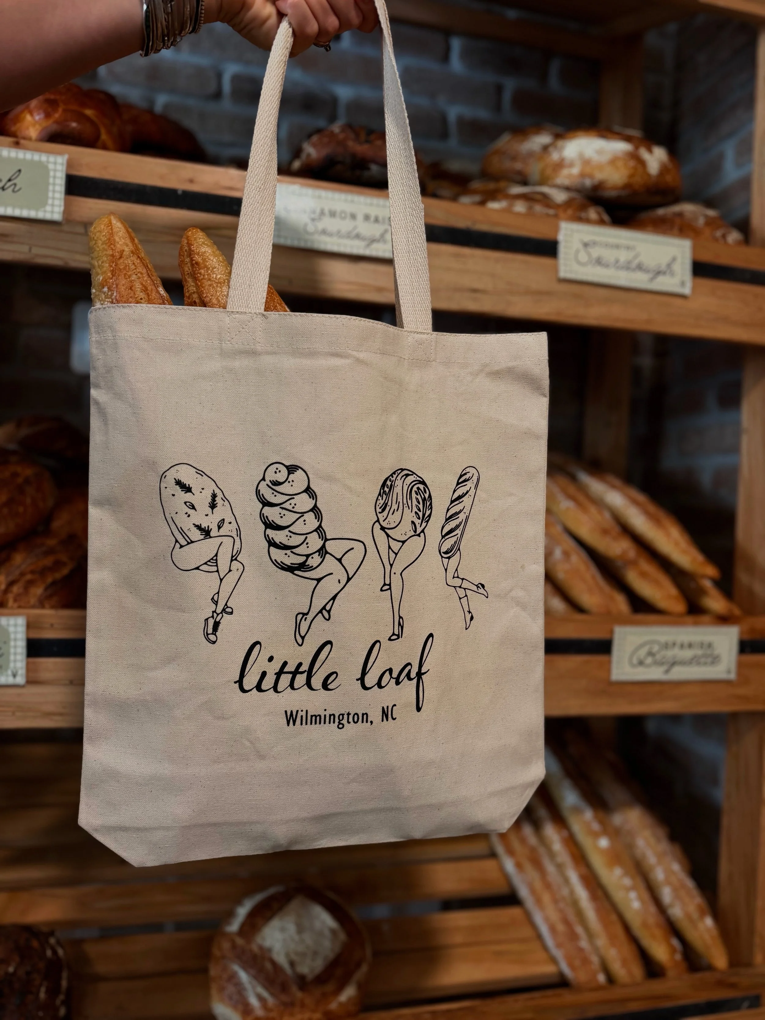 New tote bags from @rabbithole_printshop arrived yesterday and we are swooning! 😍

These are perfect to hold your little loafs or to carry your daily items! Swing by to grab yours this weekend.
