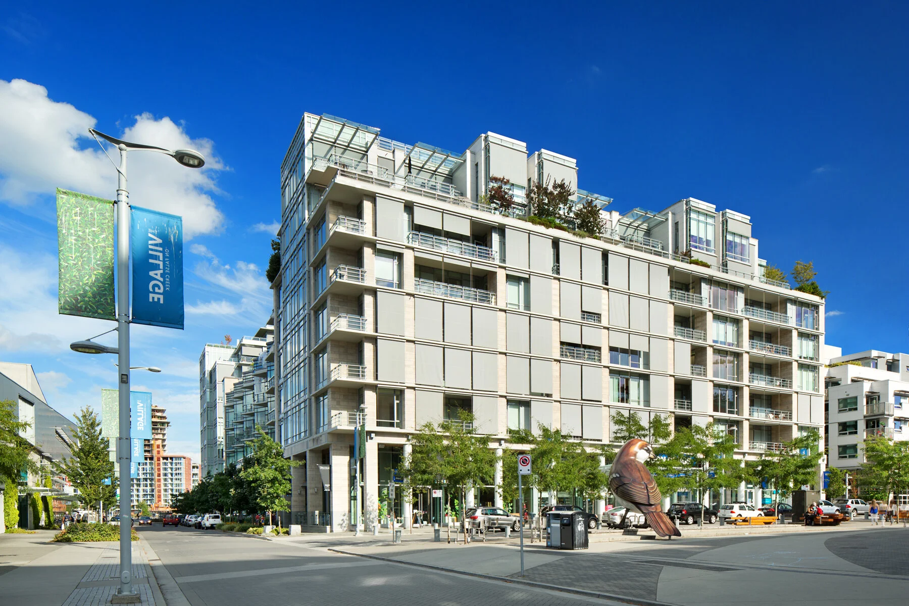 Kayak at Olympic Village: View SE from Public Square. Blinds partially lowered. Design Concept: Gregory Borowski at Merrick Architecture for Millennium. Photo: Ema Peter 2013