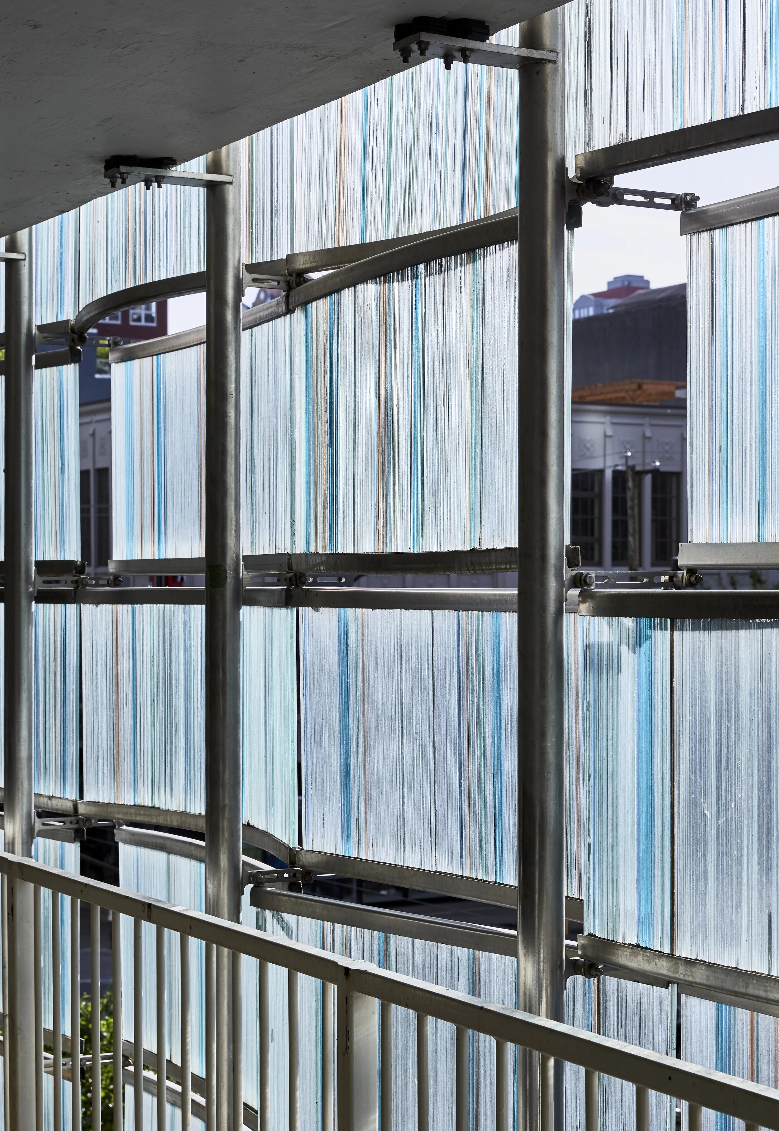 Symphony Place: Detail of Art Glass. Artist: Lutz Haufschild. Building Design Concept: Paul Merrick. Detail Design: Gregory Borowski at Merrick Architecture for Solterra. Photo: Sunny Jhooty 2017