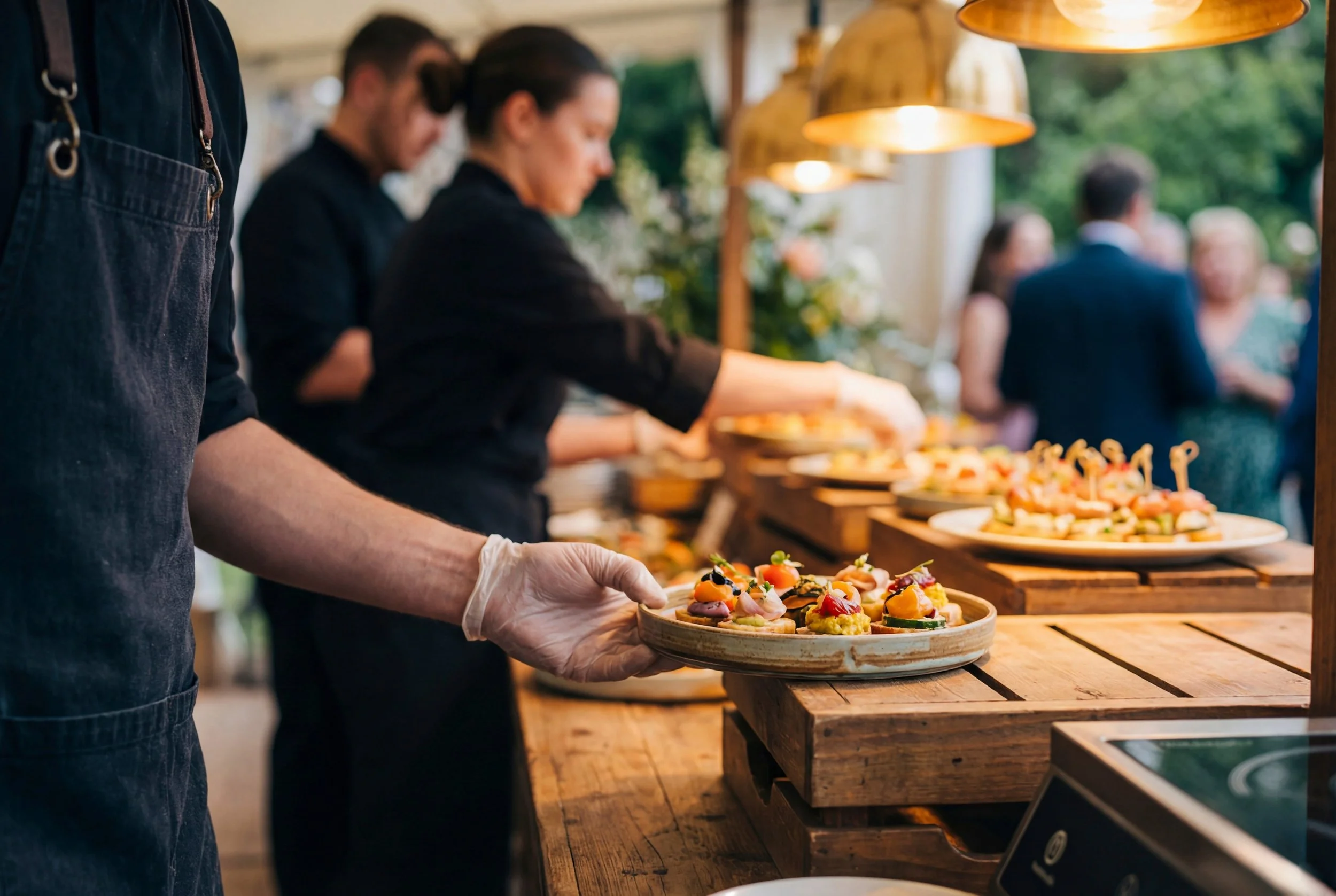 Professional catering team preparing and serving appetizers at an event