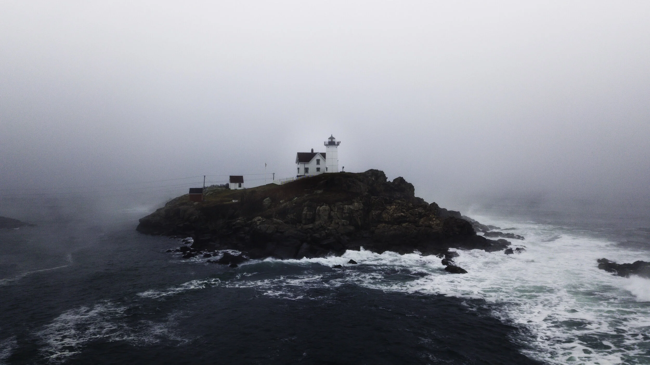 Maine Lighthouse along the coast during a road trip and hike.