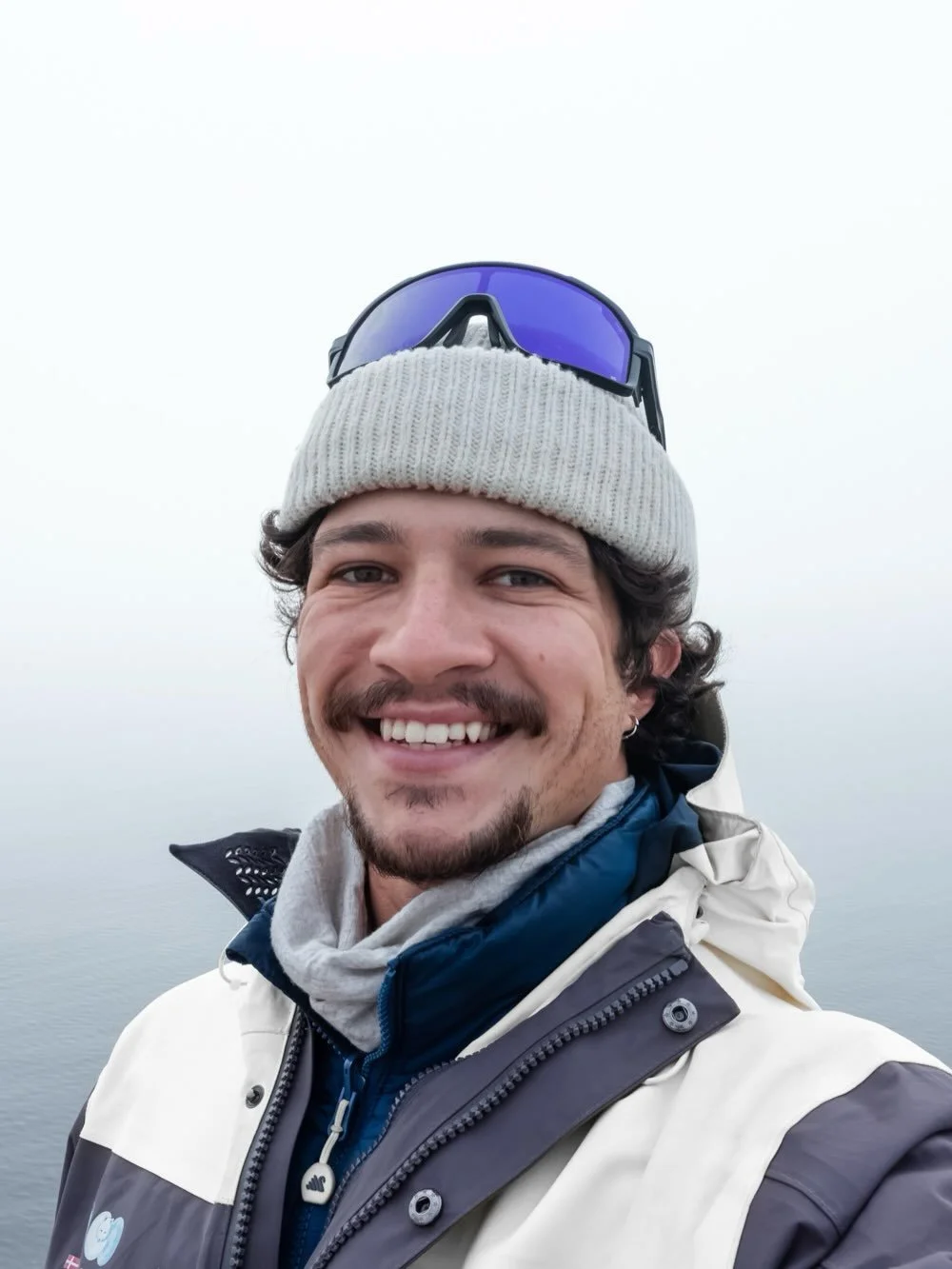 Sailing my way through the pack ice near Greenland. Some weather challenged our route but we pushed through this beautiful and icy scenery. Thick fog blanketed the surface of the water while the icebergs crashed against the hull of the ship. Screechi