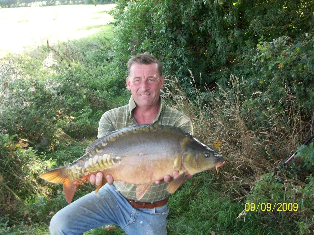 Simon with a lovely mirror caught 14 years ago when it was rarely fished, before The Cabin was built