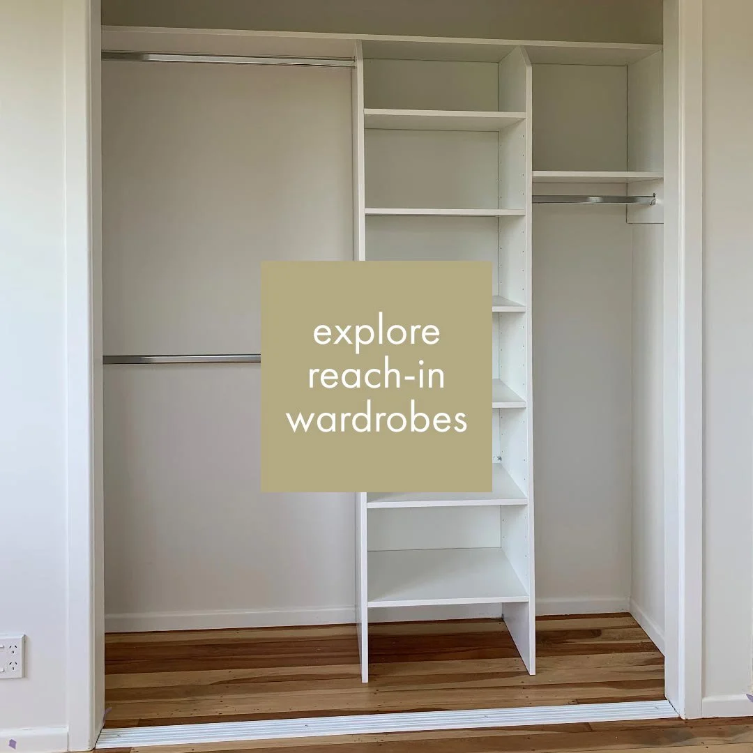 Empty reach-in wardrobe with open shelves and hanging rods, with an overlaid text box saying 'explore reach-in wardrobes'.