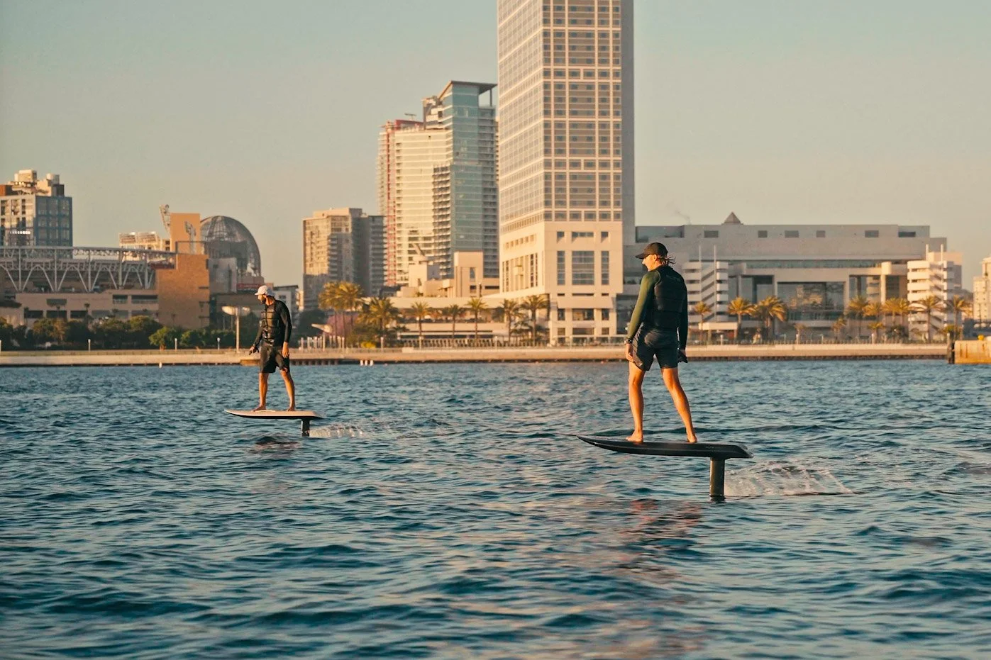 Student learning to ride a Fliteboard during an eFoil lesson in Mission Bay, San Diego