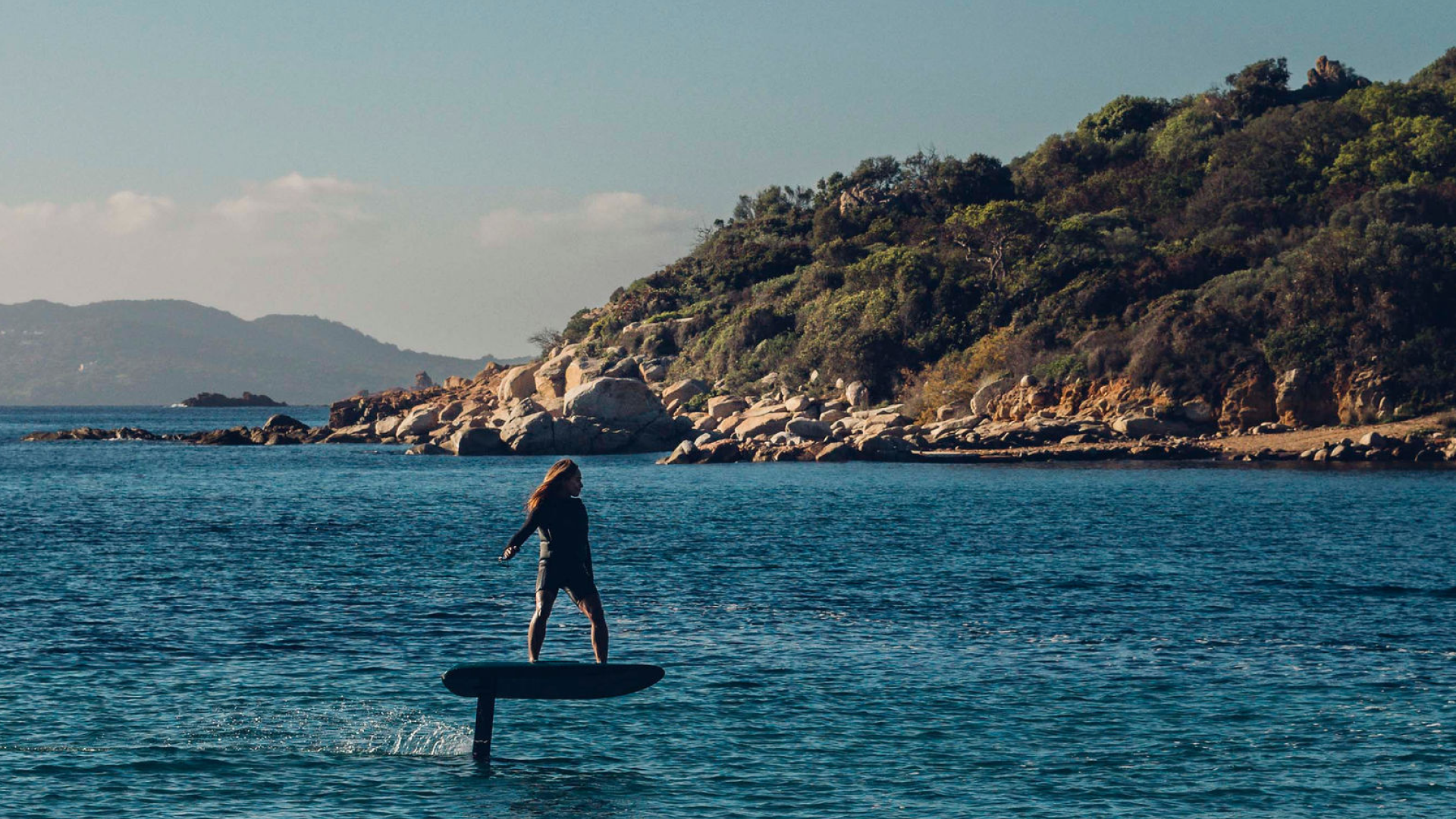 Female rider eFoiling on the new ICON Fliteboard, showcasing stability and performance
